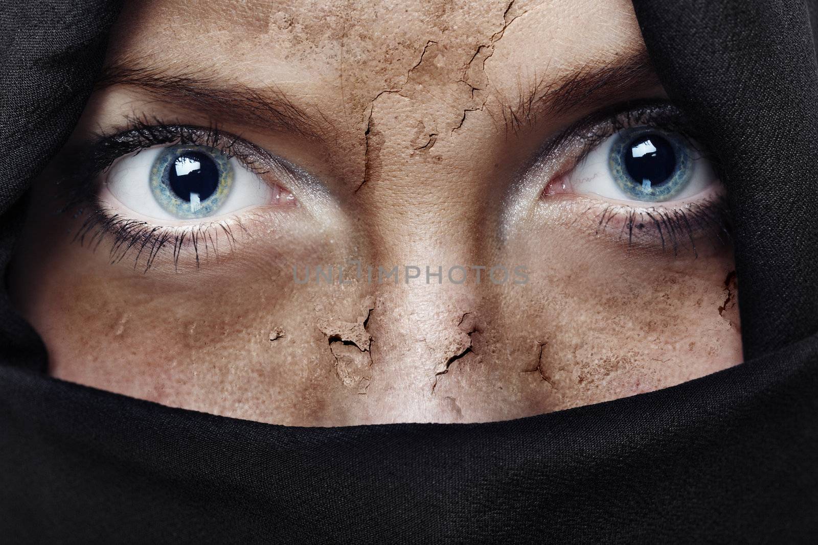 Face with damaged skin covered by headscarf