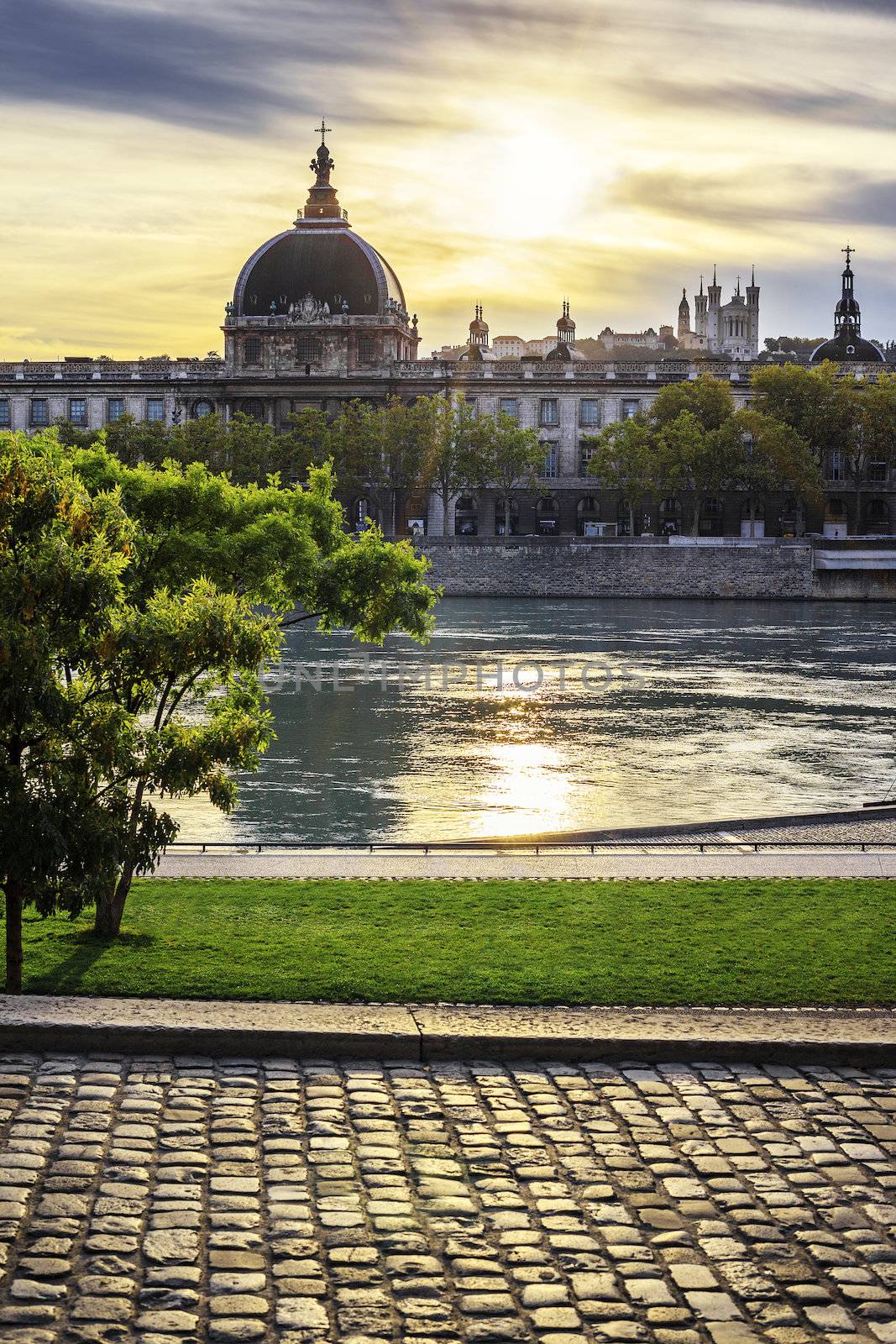 Lyon city at sunset with Rhone river by vwalakte