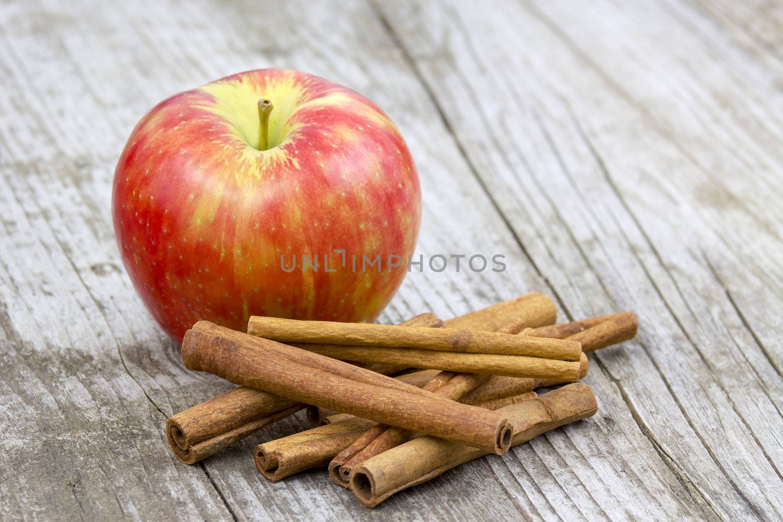 Red apple and cinnamon sticks 