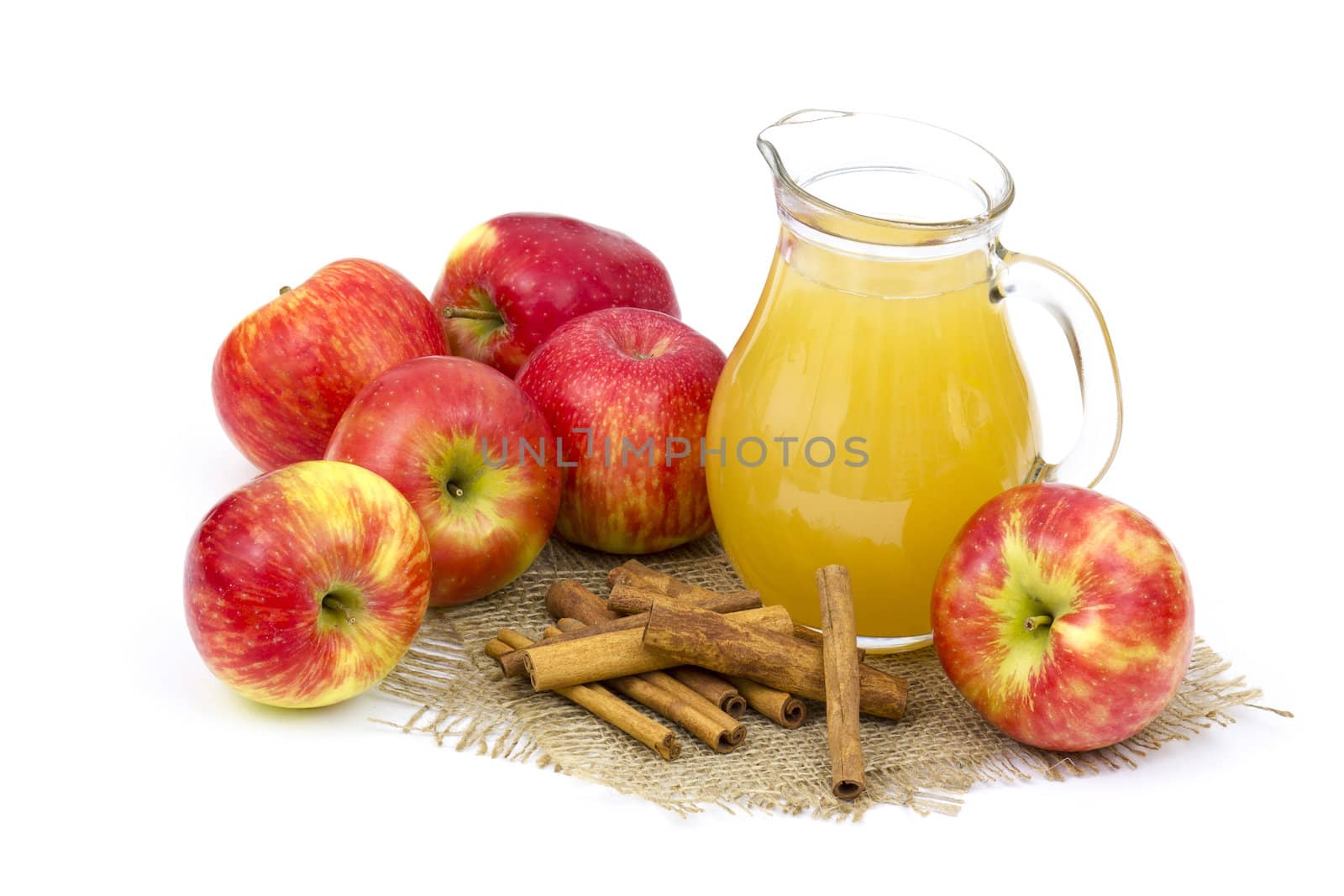 Apple juice and apples on wooden background