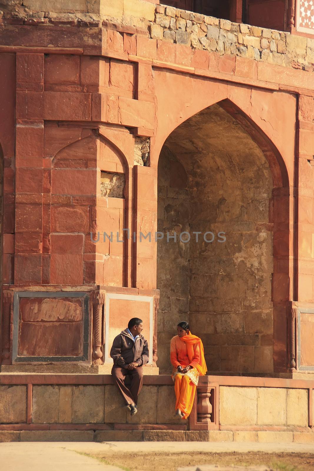 Indian couple sitting at Humayuns private library, Purana Qila,  by donya_nedomam