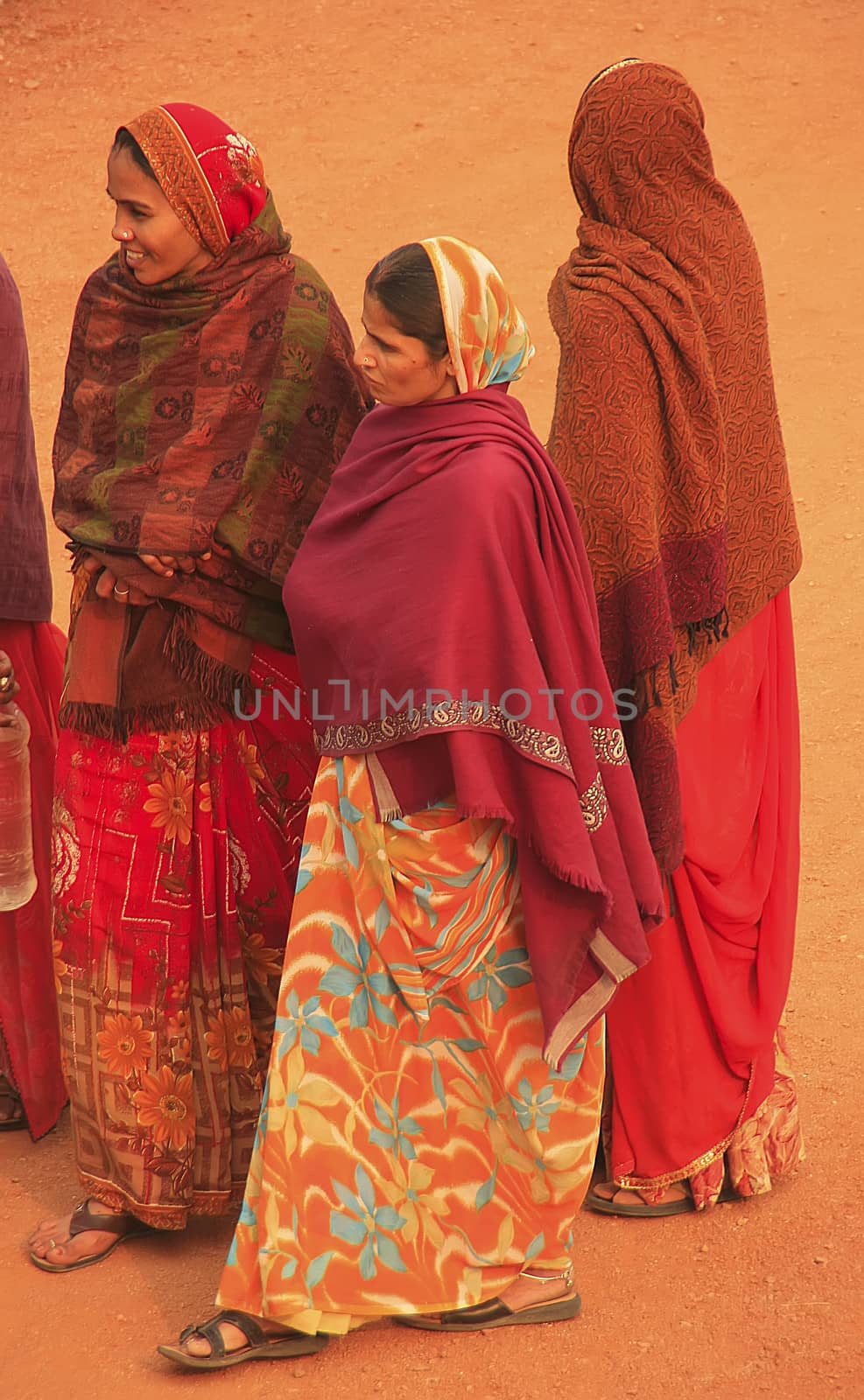 Indian women in colorful sari standing in courtyard of Safdarjung Tomb, New Delhi, India