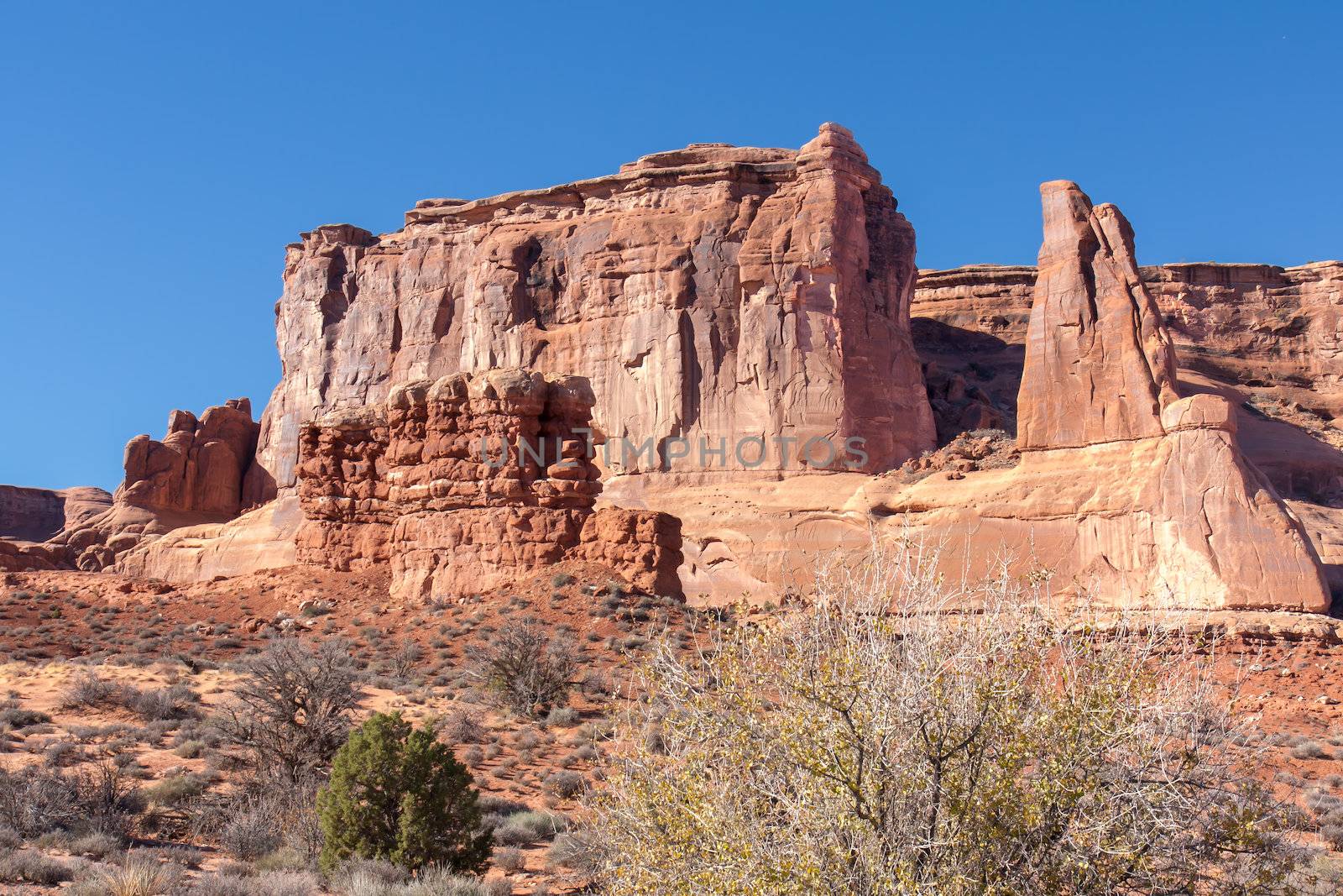 With this huge formation at Arches National Park the outer layer can be seen slowly eroding away from the solid rock underneath.