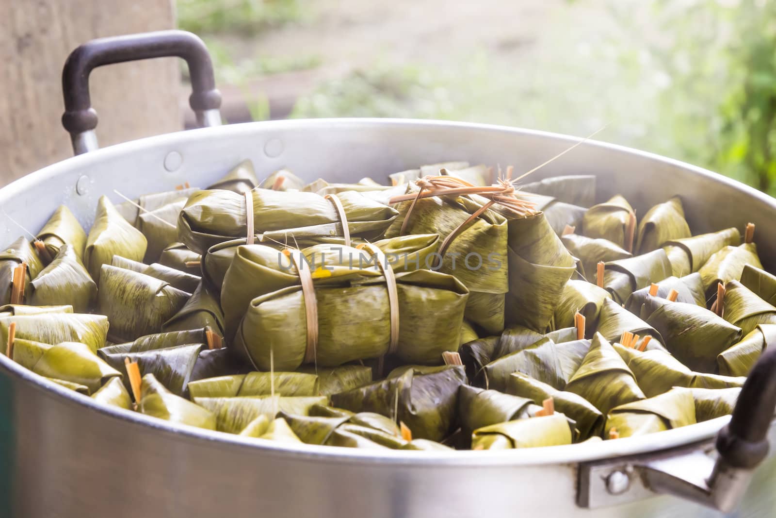 Khao Tom Mad, steamed sticky rice with banana ,made from banana by photo2life