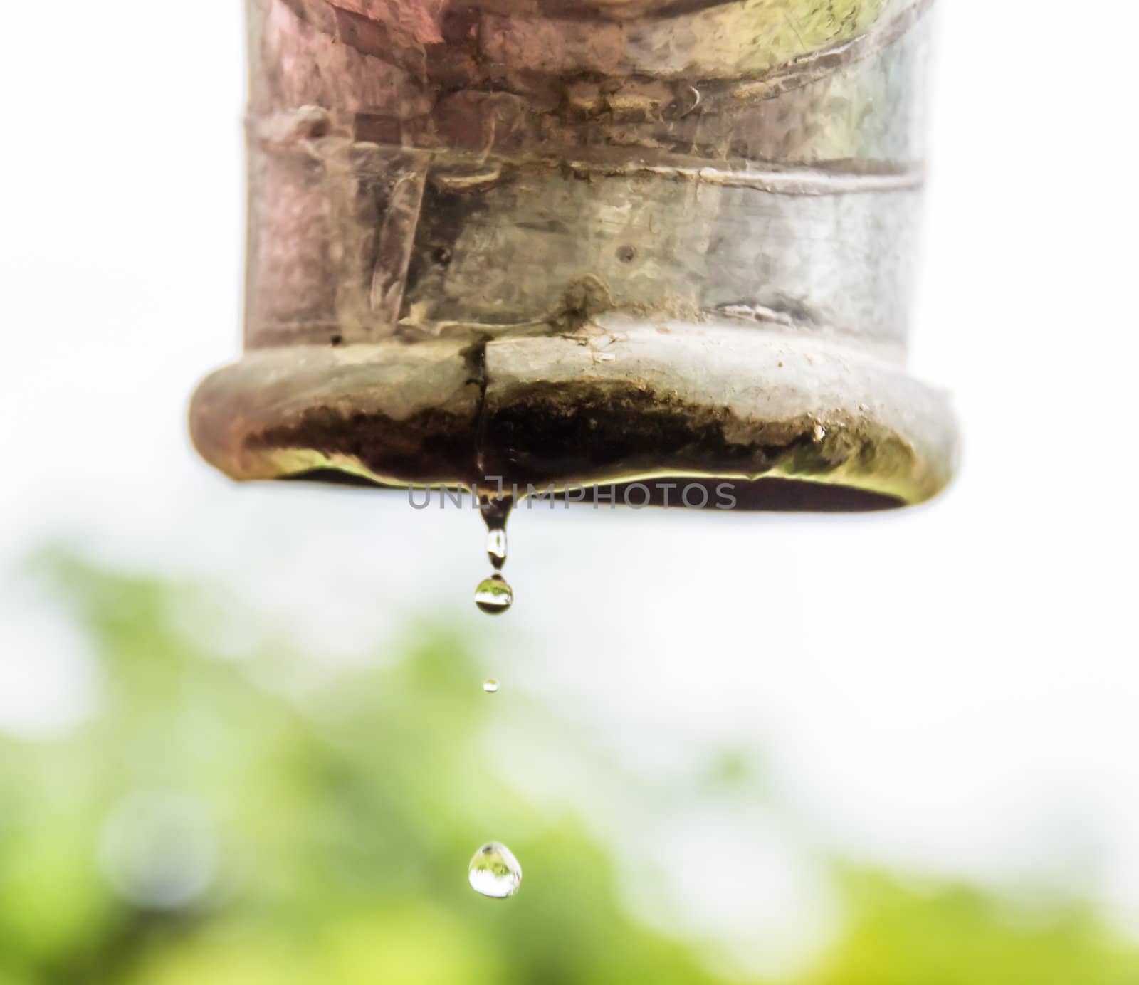 Water drips from a pipe.