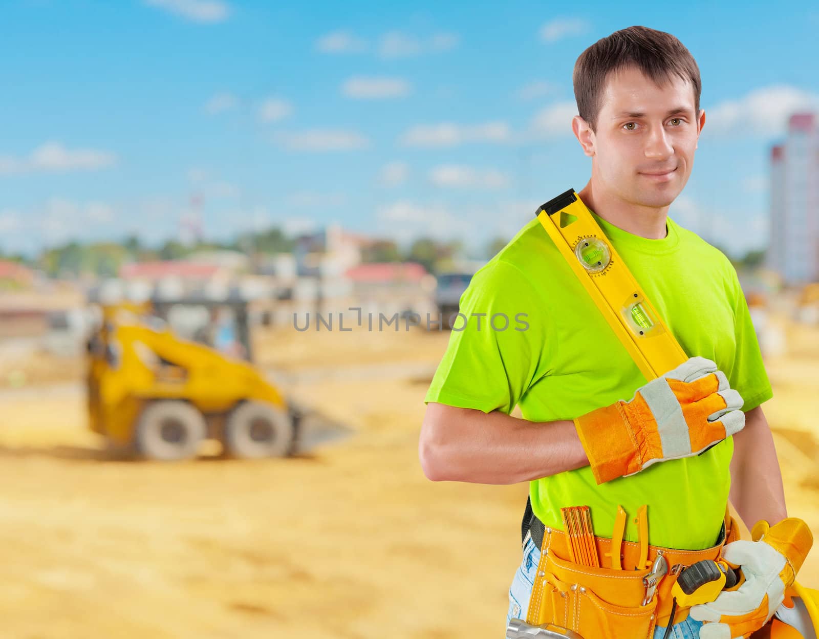 worker holding construction lewel