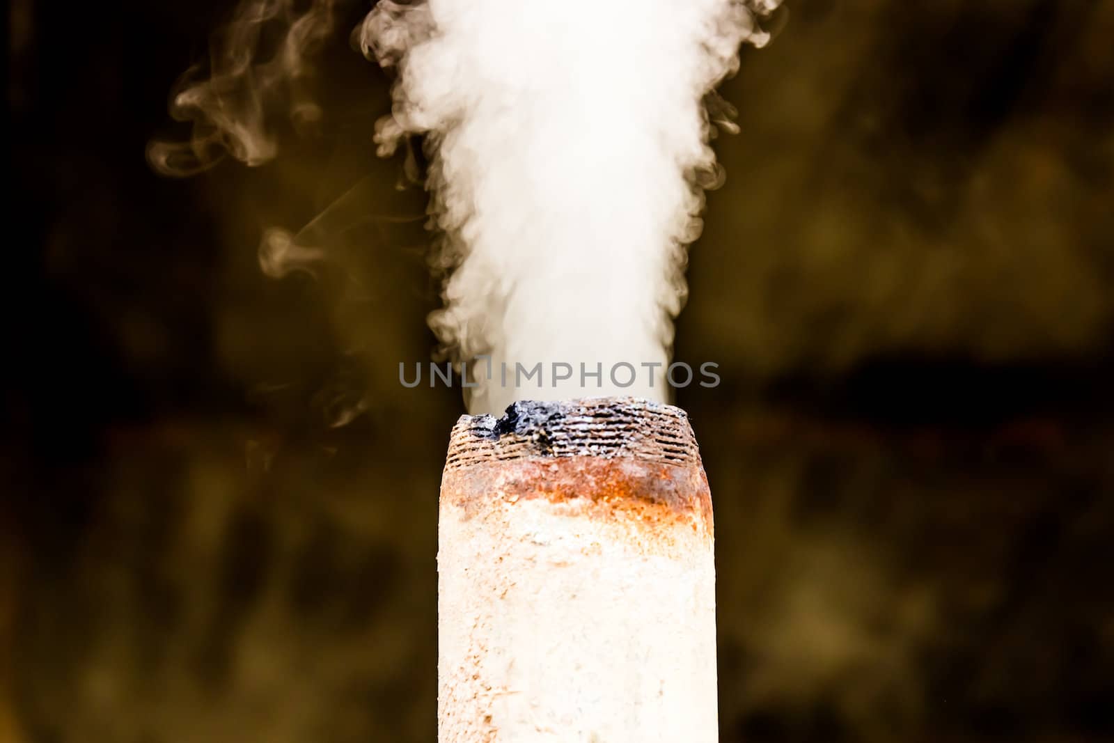 Smoke coming out of the pipe.