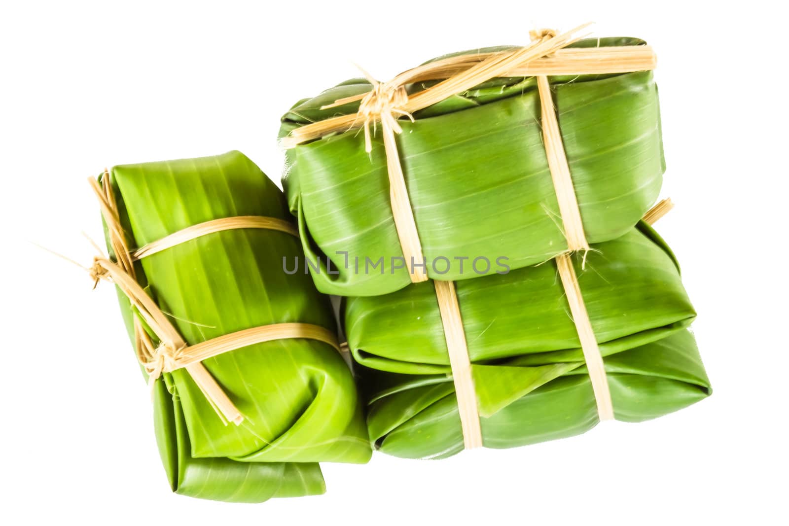 Khao tom mad is a Thai traditional dessert made from sticky rice, coconut milk, sugar , and bananas wrap with banana leaf.