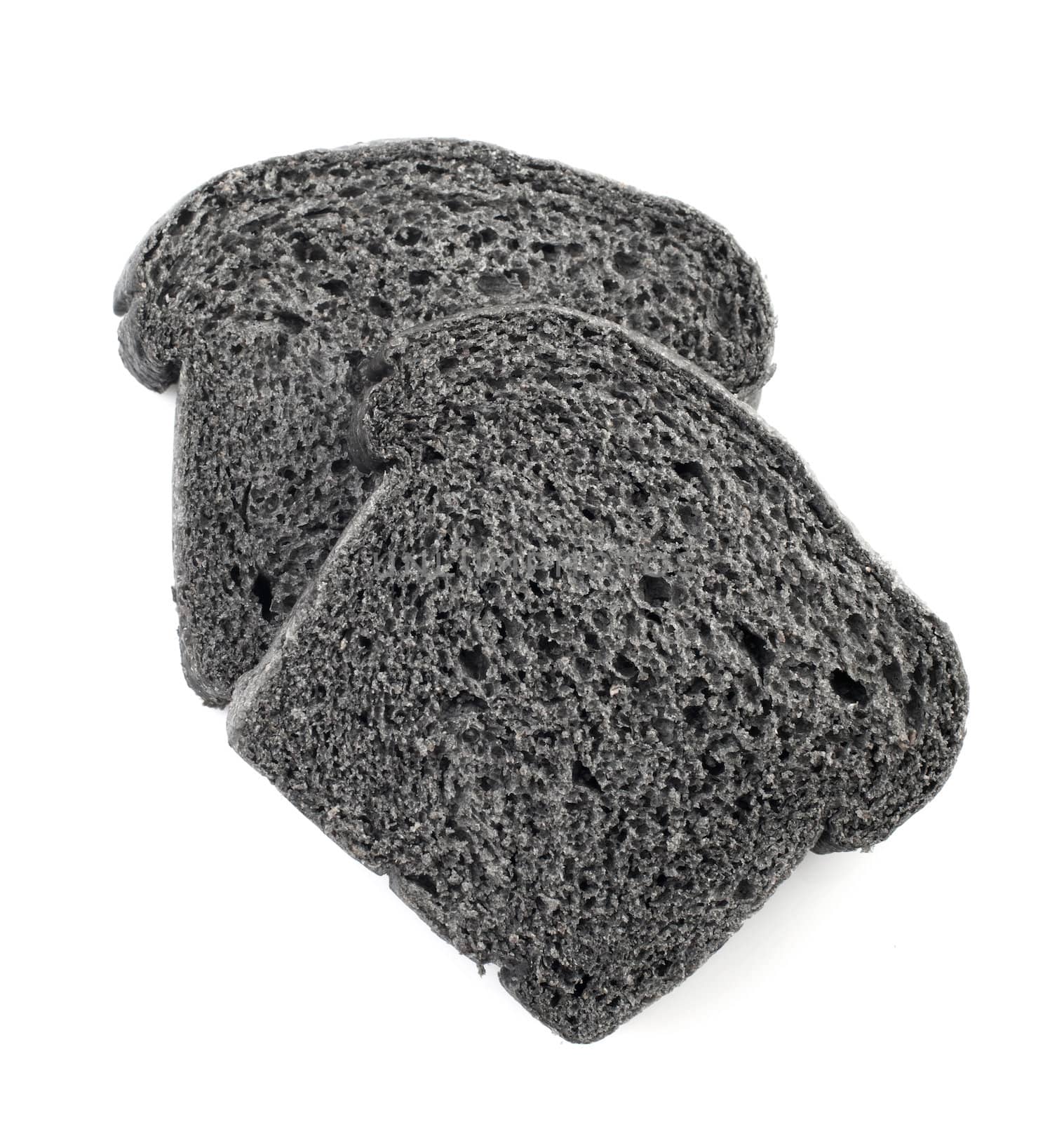 Slices of organic black charcoal bread isolated on white background