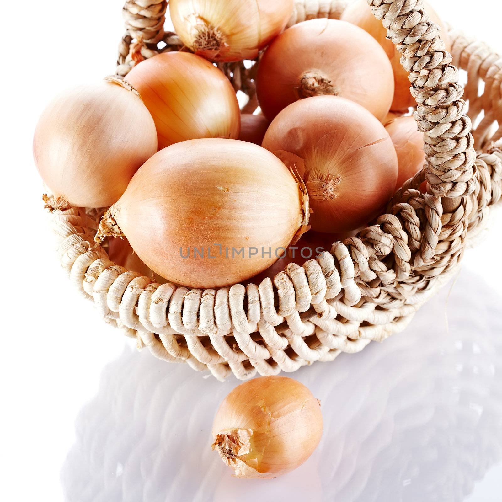 Onions napiform in a basket by Azaliya