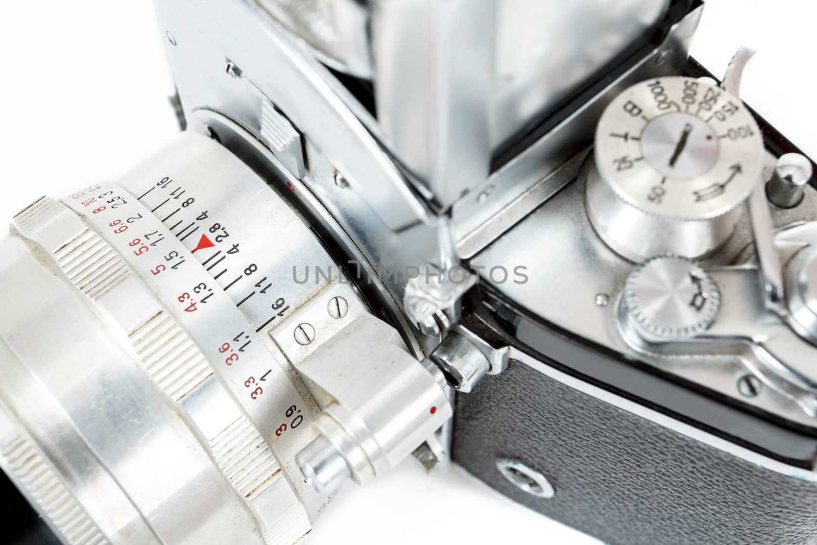 detail of retro old vintage analog photo camera on white background view from the top