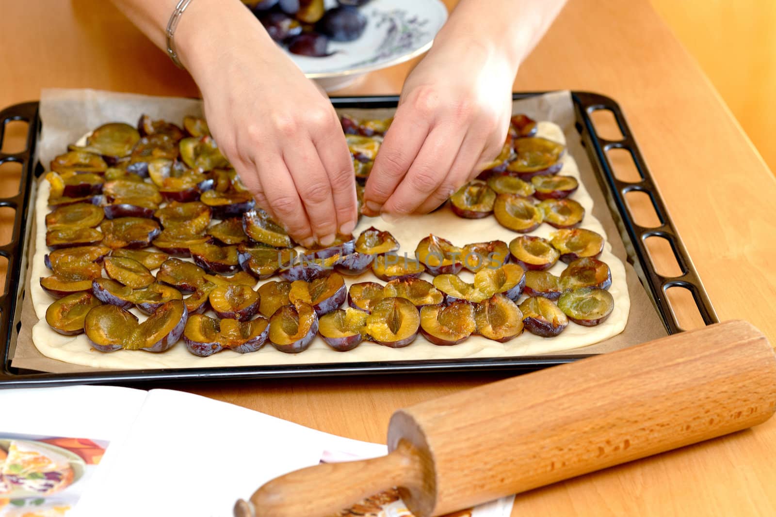 preparing, baking plum cake, placing plums on dough