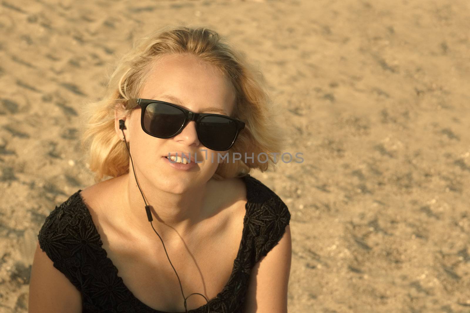 Young girl on the sandy beach by qiiip