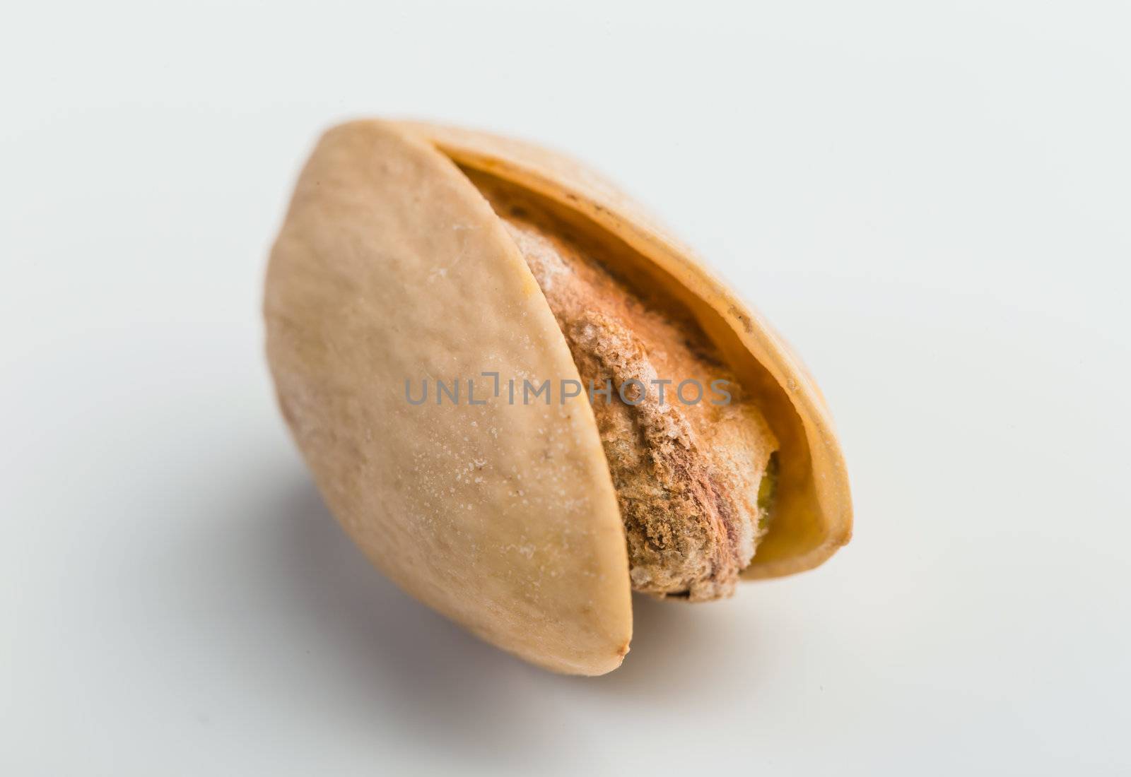 The dry pistachio on the white background