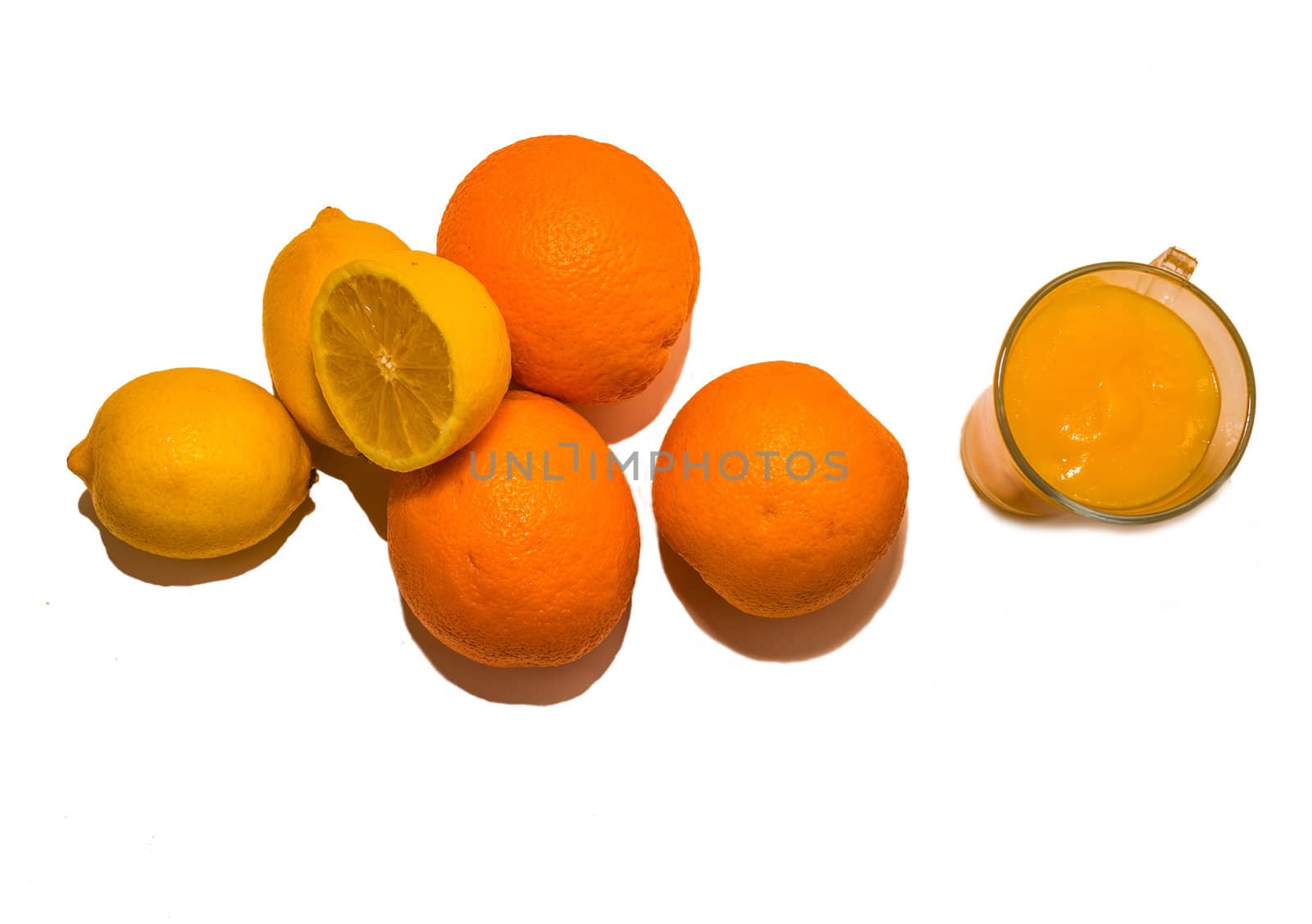 Citrus fruits and orange juice on white