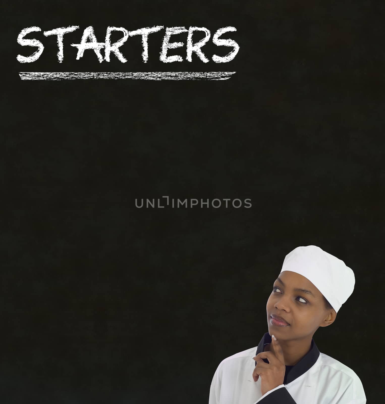 Chef with chalk starters sign on blackboard background by alistaircotton