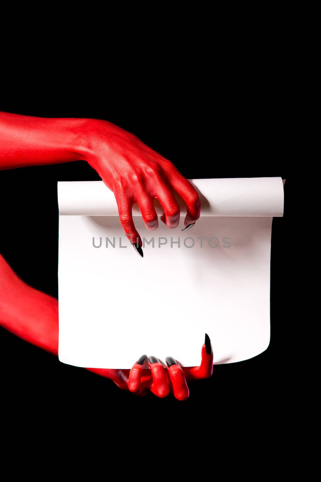 Red devil hands holding paper scroll, deal with devil concept 