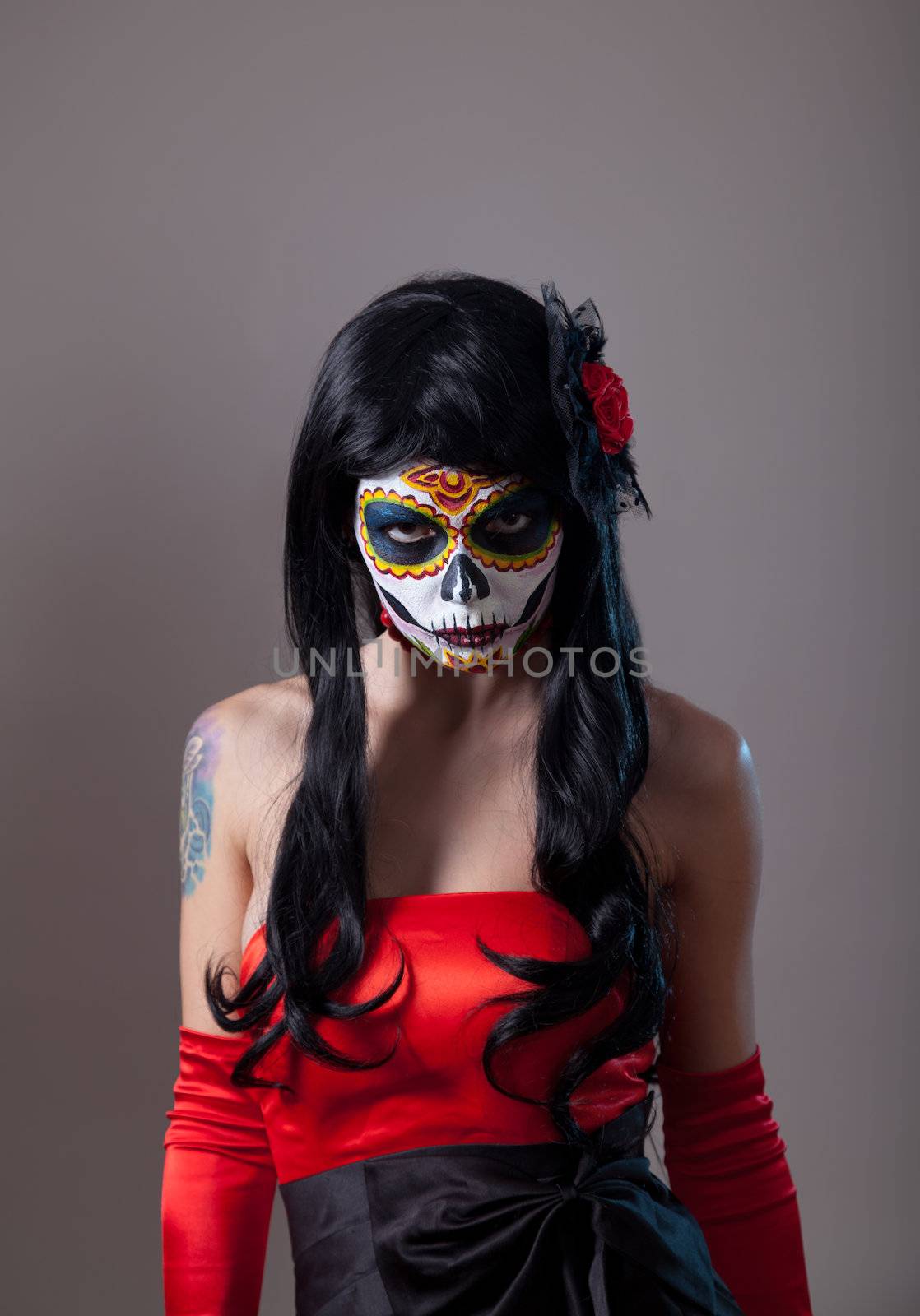 Sugar skull girl with red rose, Mexican Day of the Dead or Halloween 