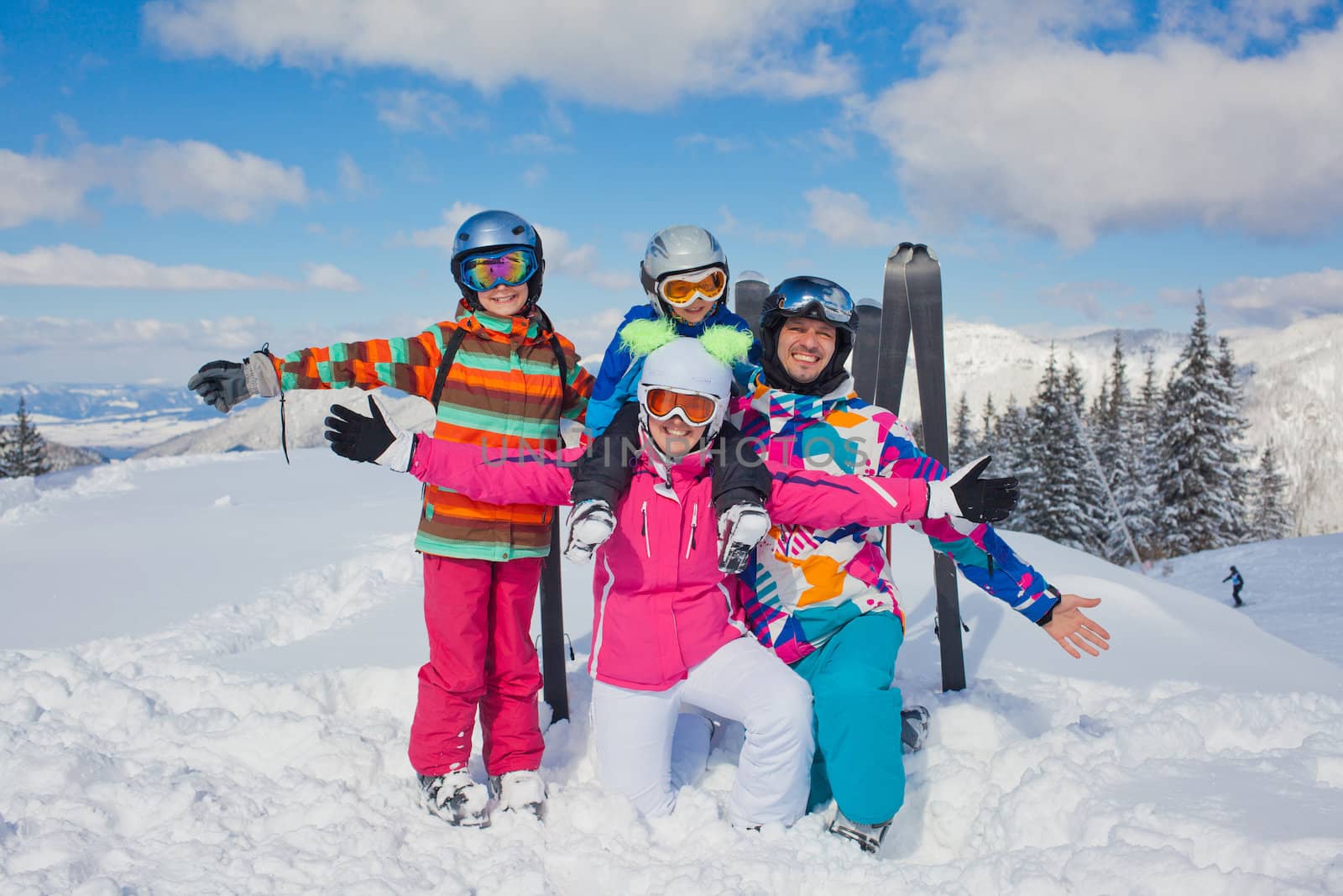 Skiing, winter, snow, sun and fun - family enjoying winter vacations