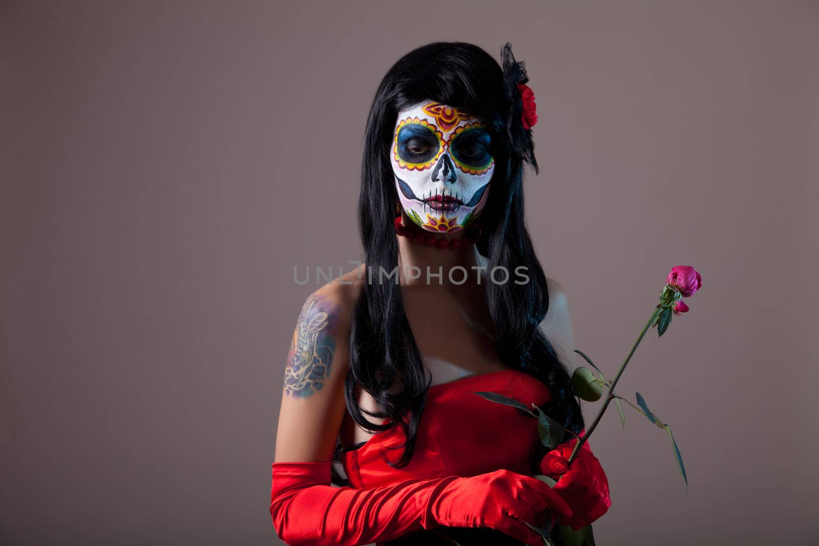 Sugar skull girl with red rose, Halloween shot  