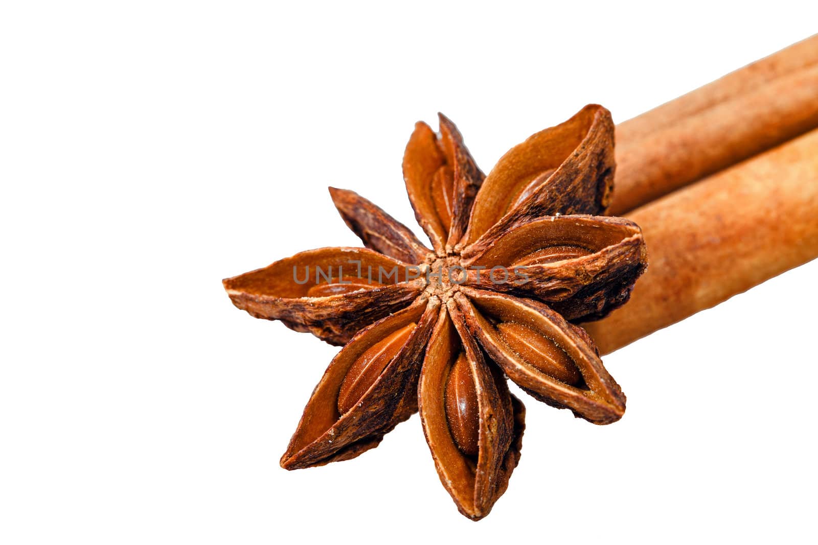 Star anise and two cinnamon sticks isolated on white background