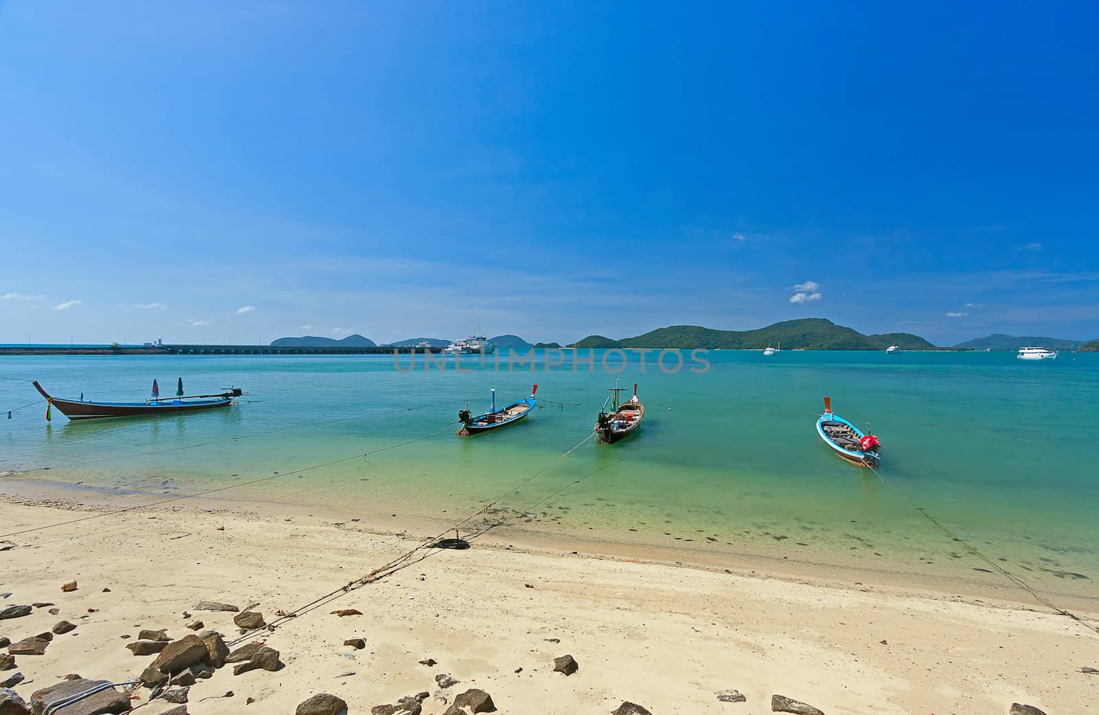 Boats near  shore waiting for tourists, Thailand. Beautiful tropical landscape.