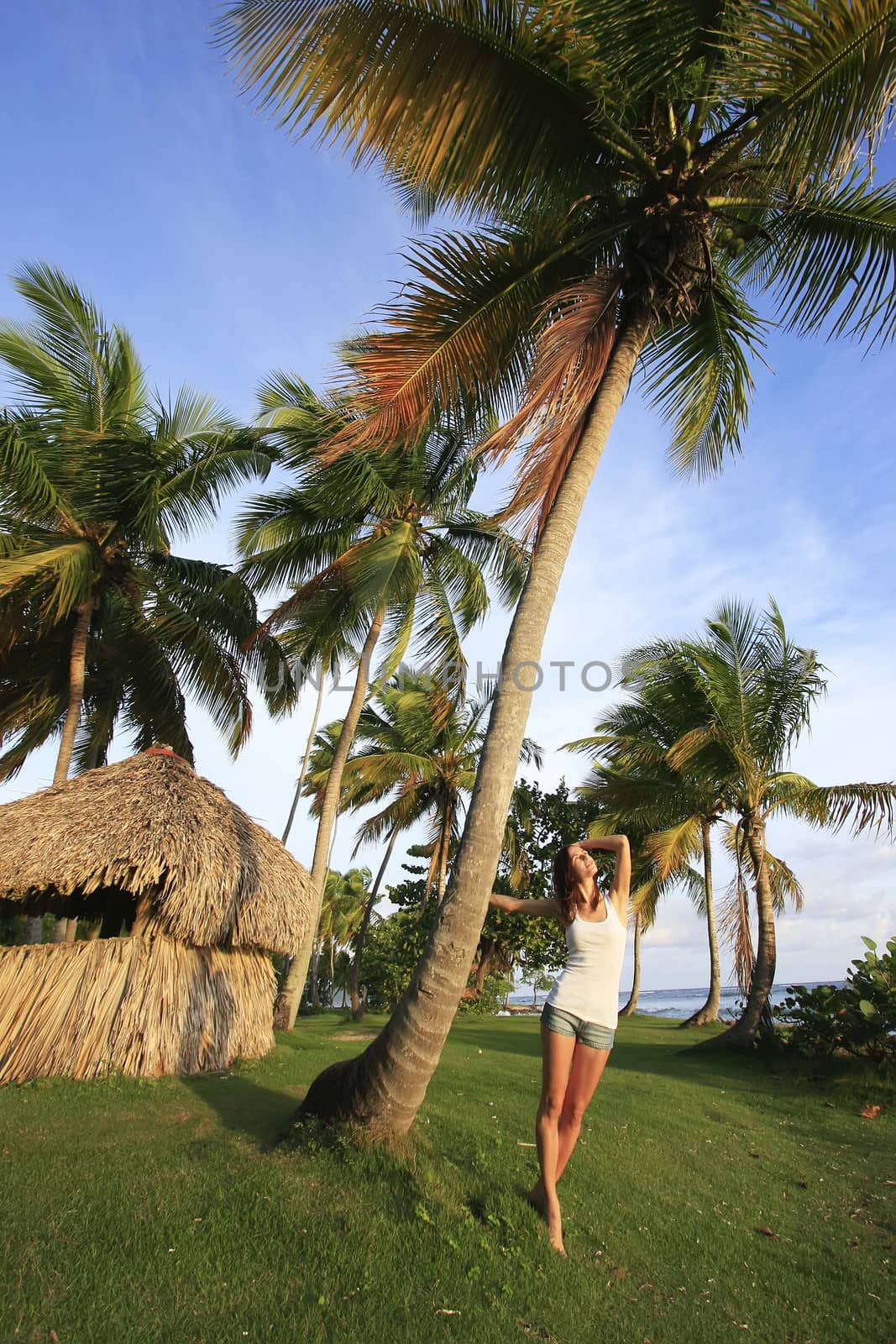 Young woman standing at Las Galeras beach, Samana peninsula, Dominican Republic