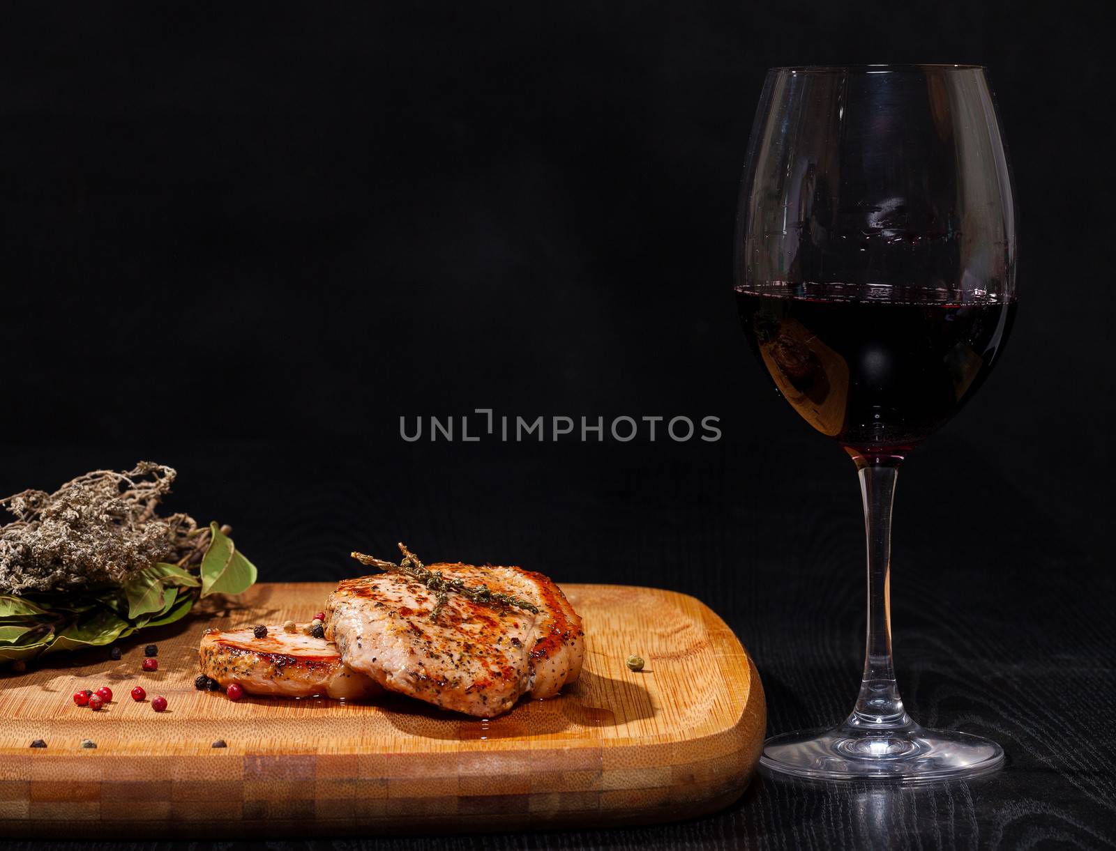 Grilled steak with glass red wine by Discovod