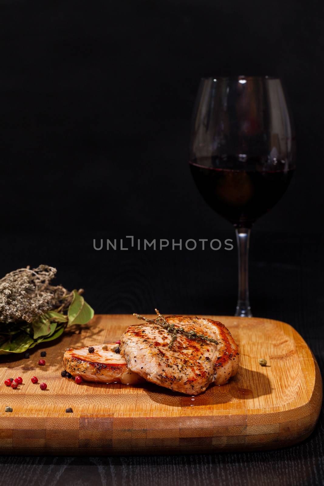 Grilled steak with glass red wine by Discovod