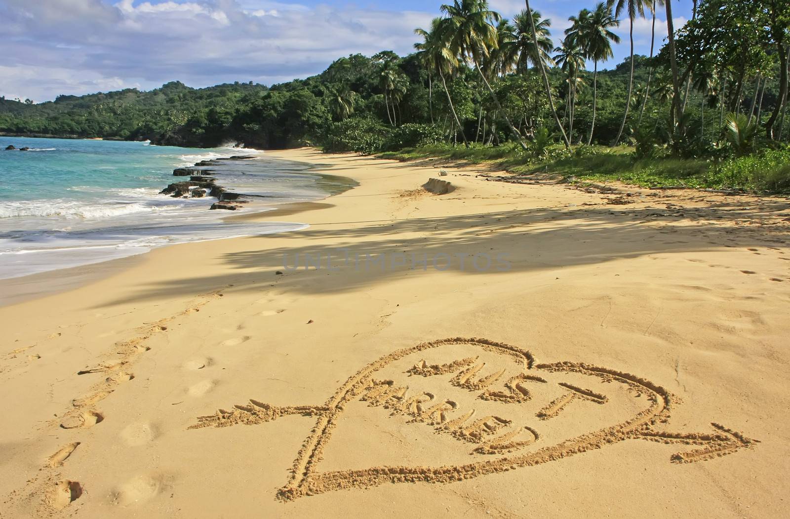 "Just married" written in sand on a beach by donya_nedomam