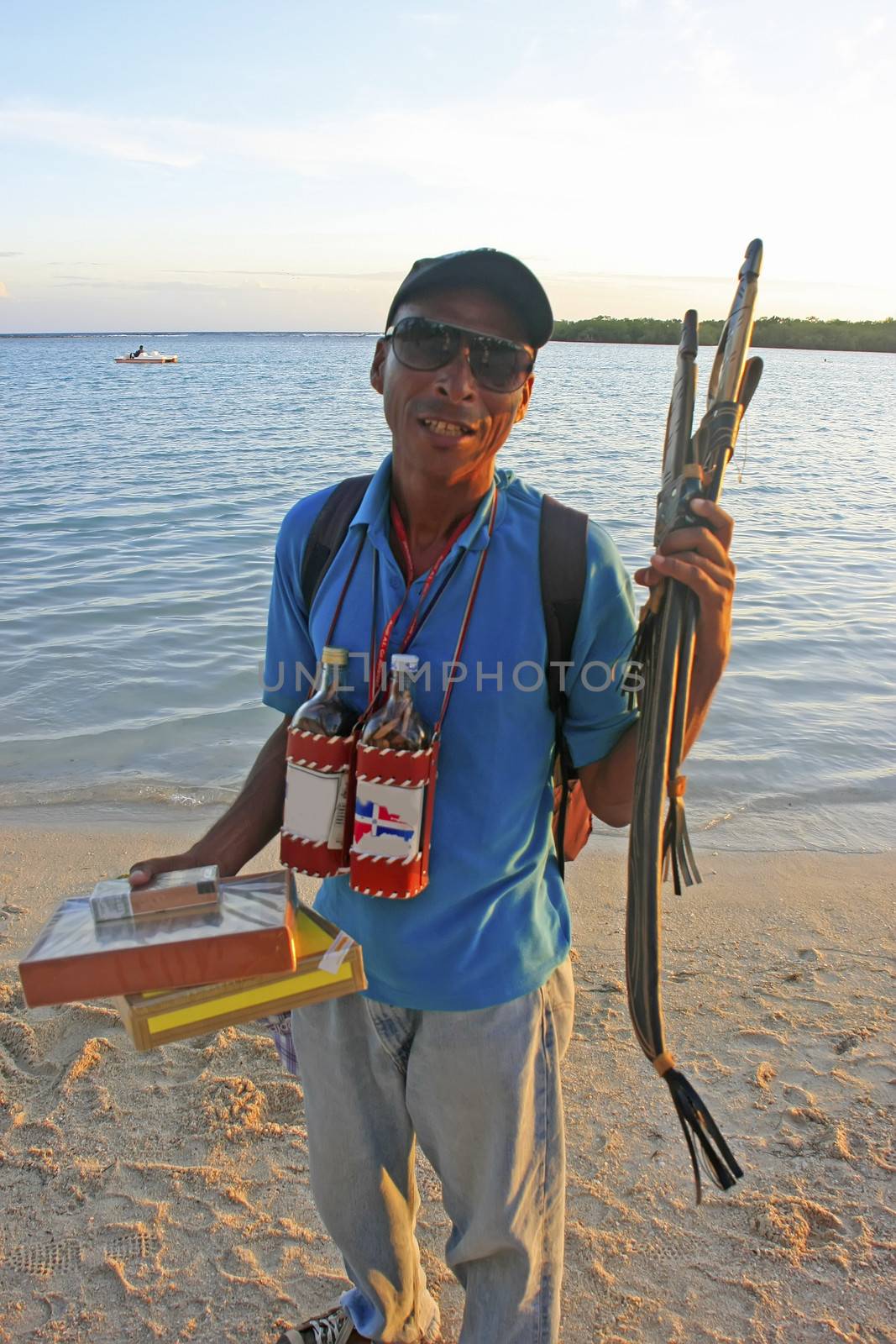 Local man selling souvenirs at Boca Chica beach, Dominican Republic