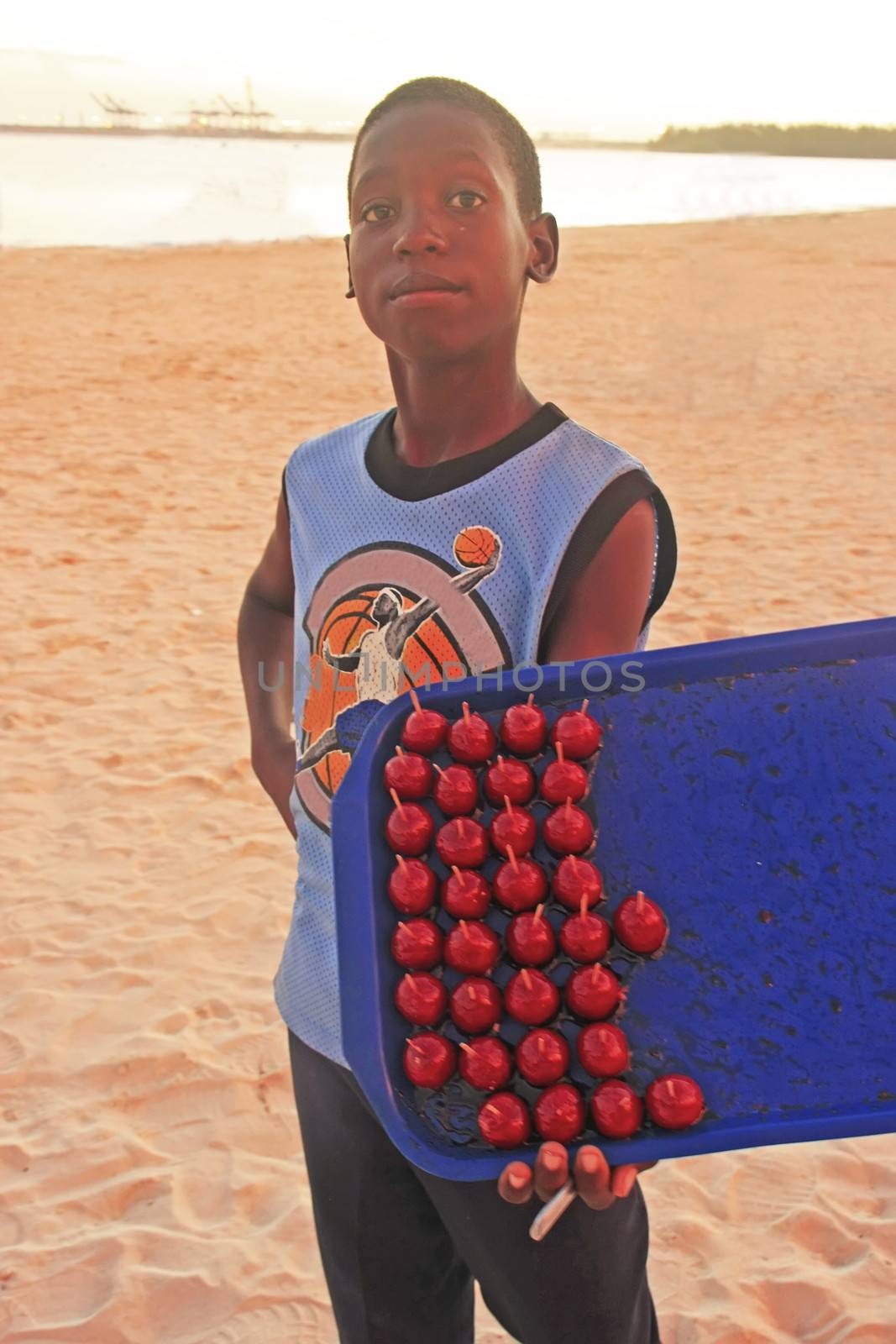 Local boy selling sweets  at Boca Chica beach by donya_nedomam