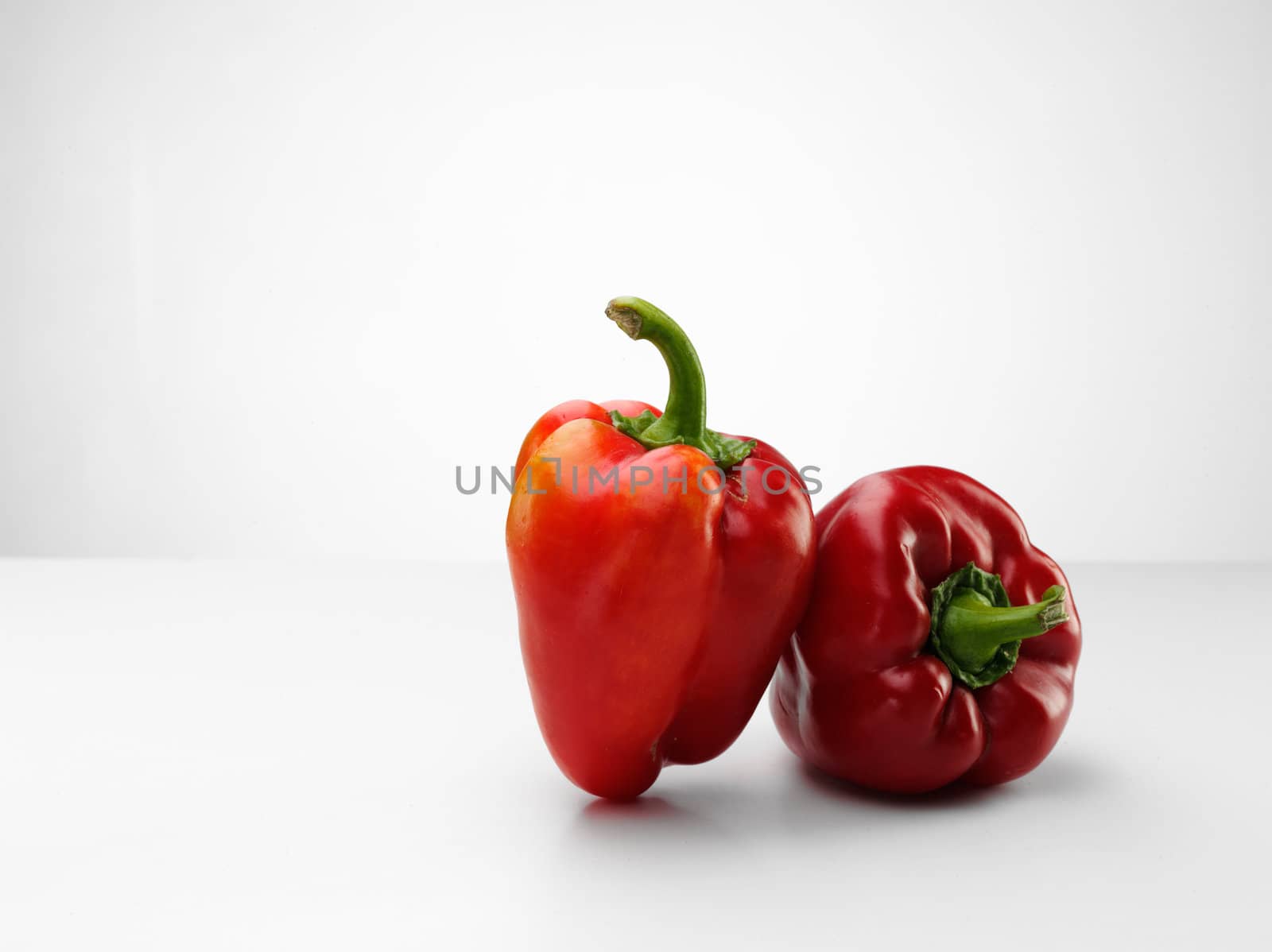 tasty fresh red paprika over white background