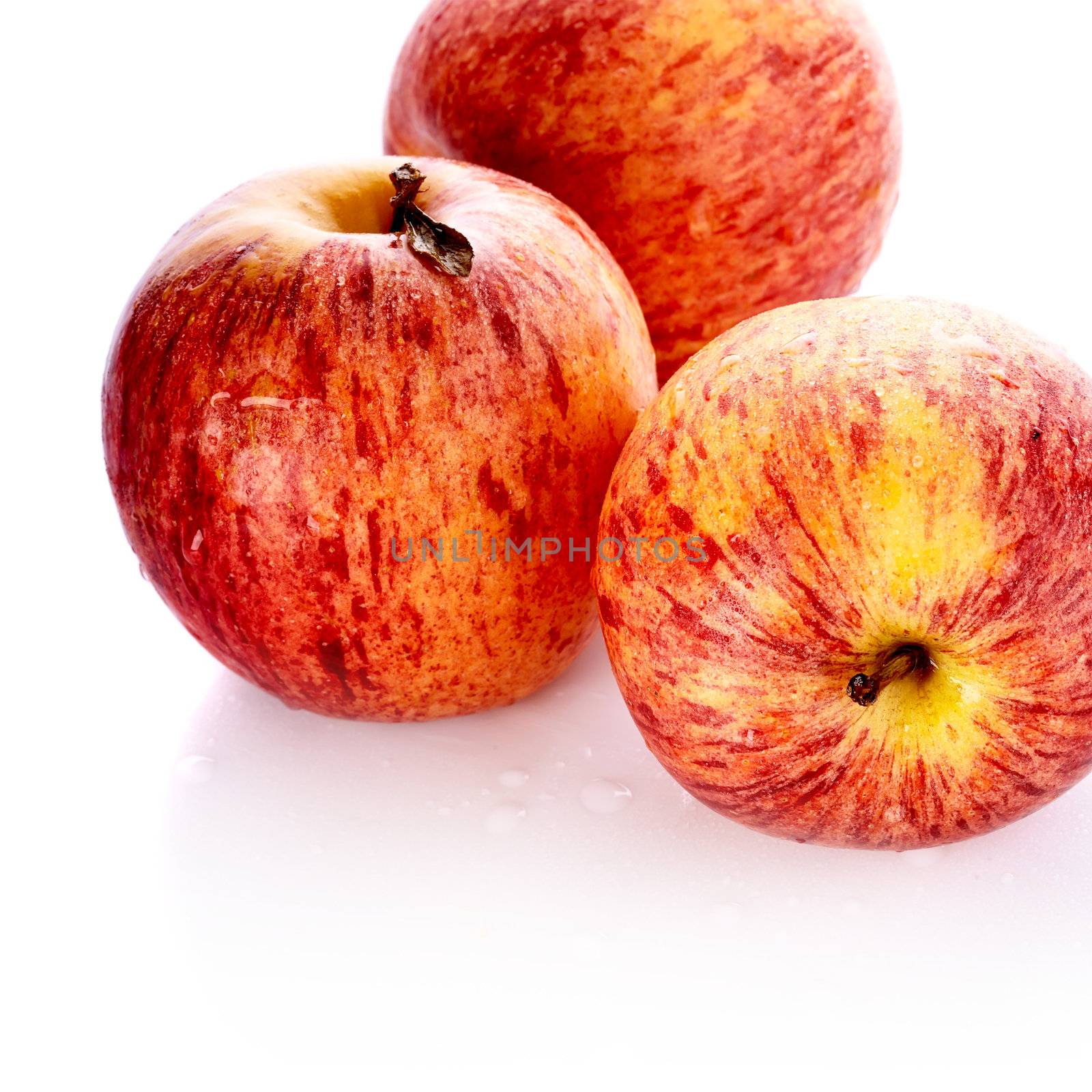 Three red apples. Useful fruit. Healthy food. Vegetarian food