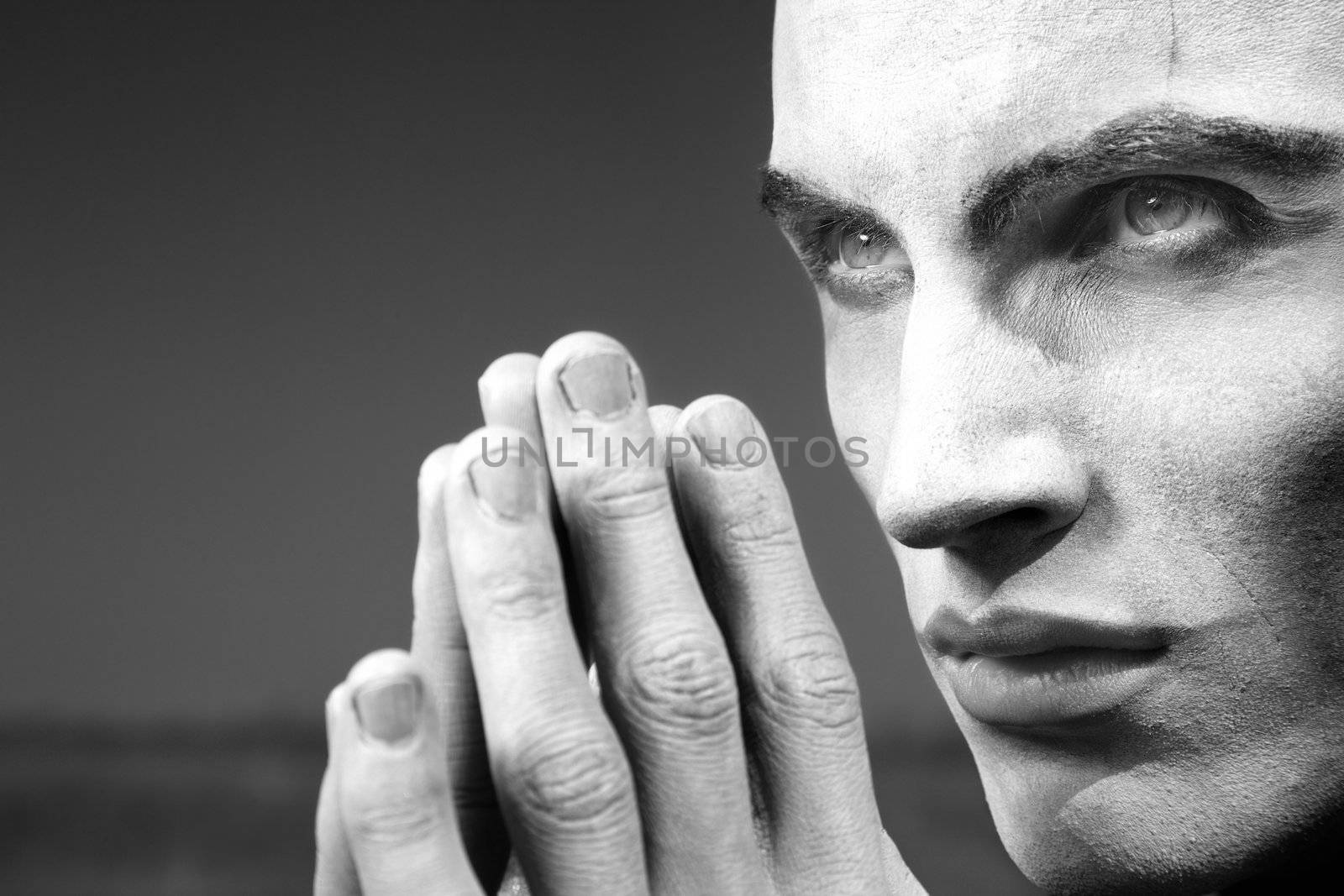 Angry vampire outdoors. Monochrome photo with special dramatic darkness