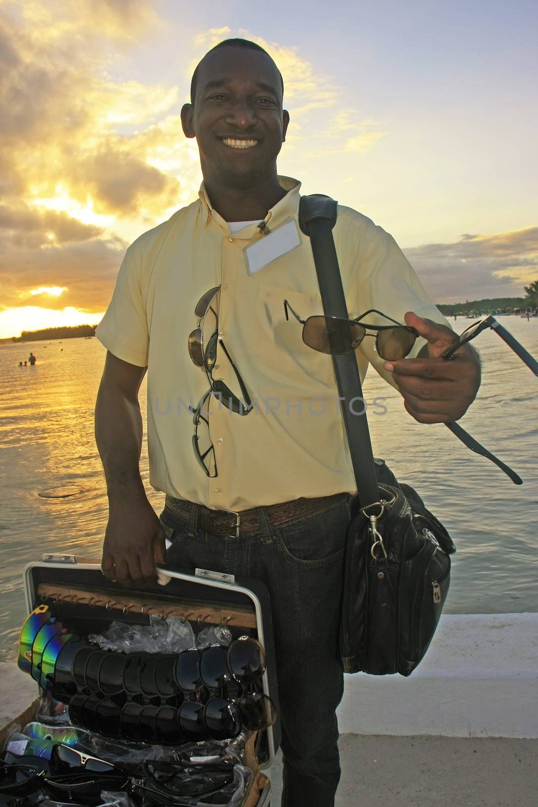 Local man selling sunglasses at Boca Chica beach by donya_nedomam