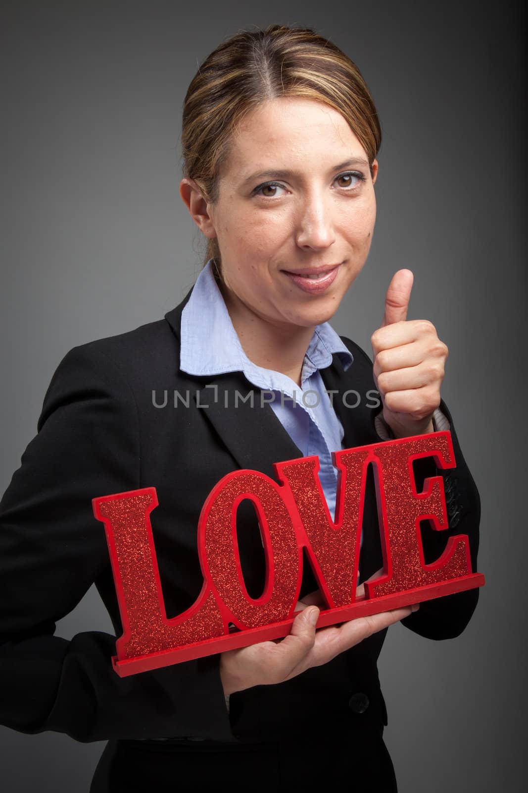 Attractive caucasion business woman in her 30s shot in studio isolated on a white background in her 30s shot in studio isolated on a grey background