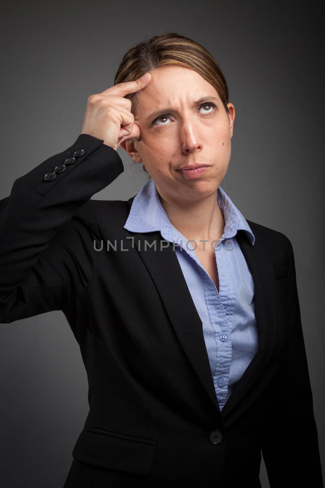 Attractive caucasion business woman in her 30s shot in studio isolated on a white background in her 30s shot in studio isolated on a grey background