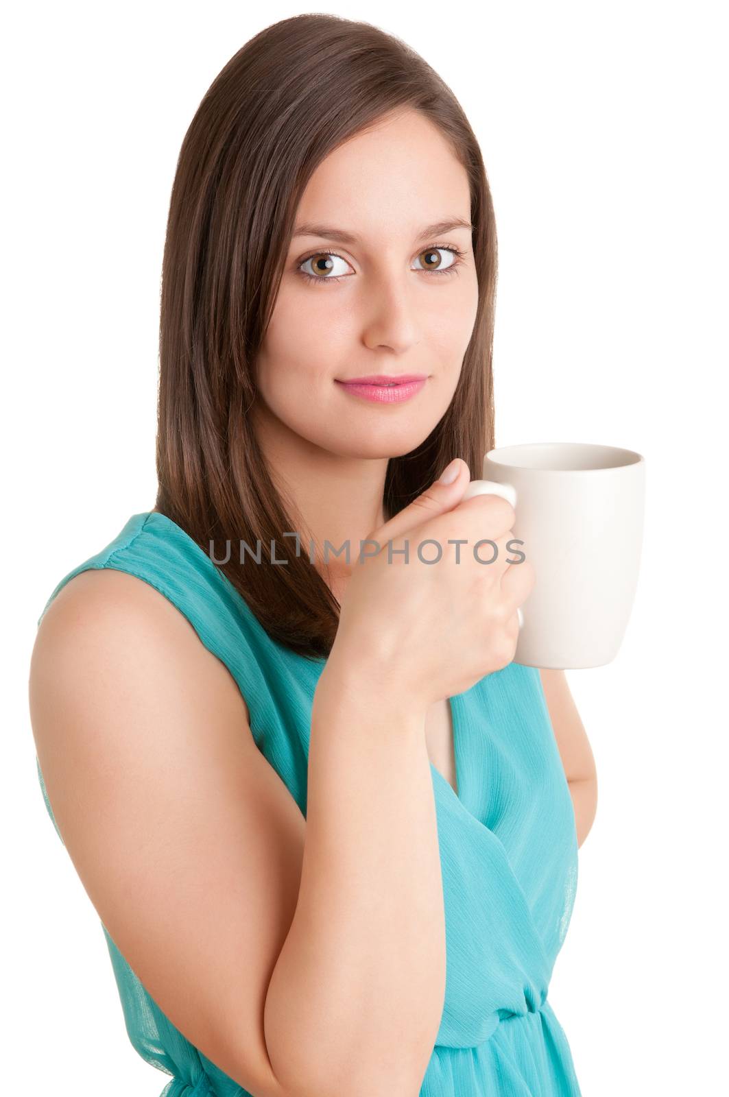 Young woman drinking a hot tea from a white cup, isolated in white