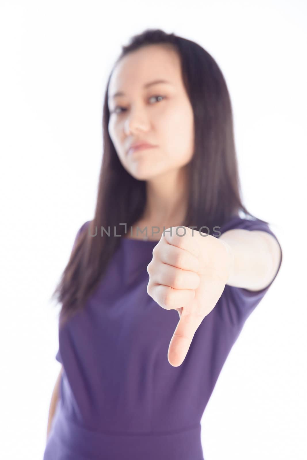 Attractive asian girl in her 30s shot in studio isolated on a white background