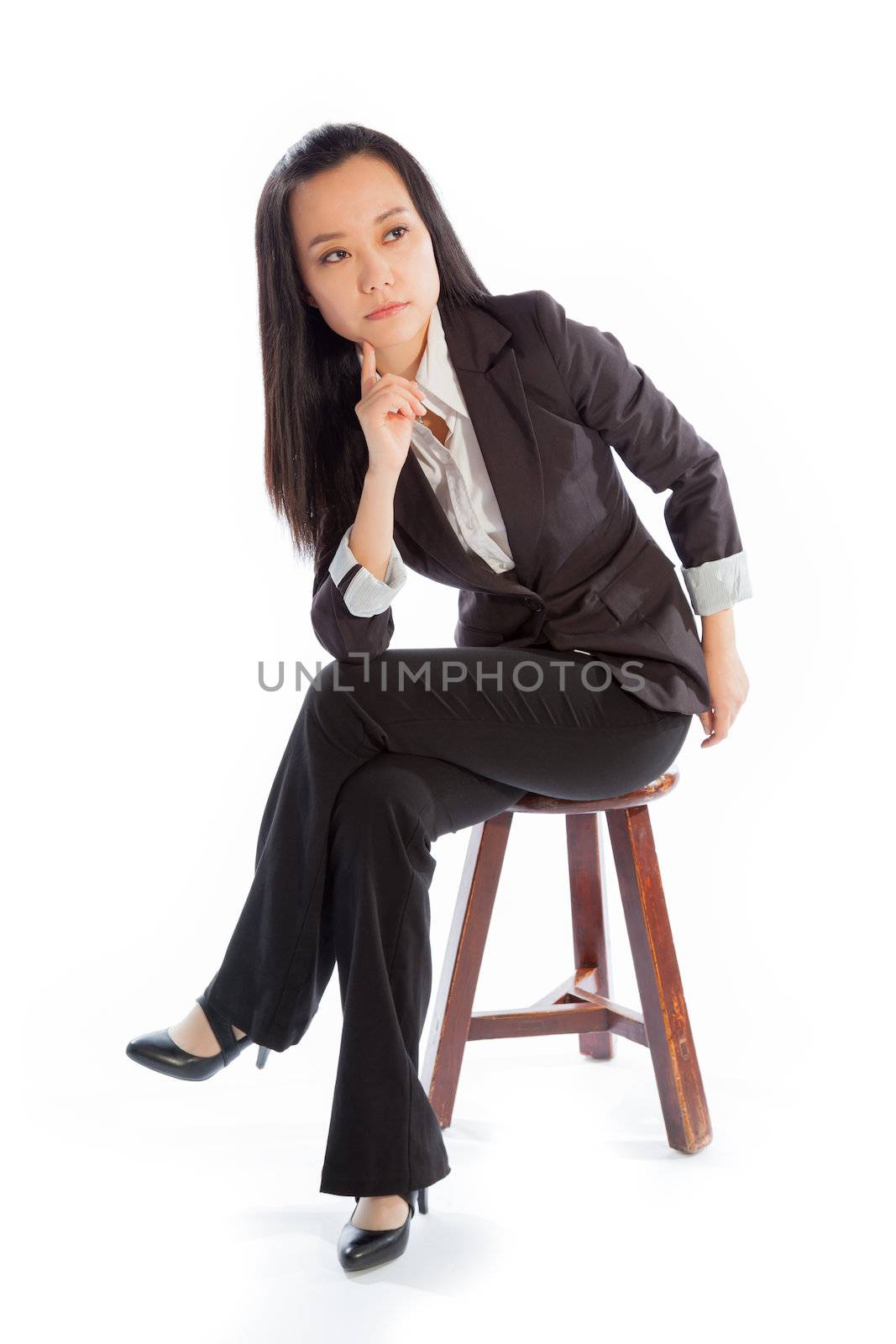 Attractive asian girl in her 30s shot in studio isolated on a white background