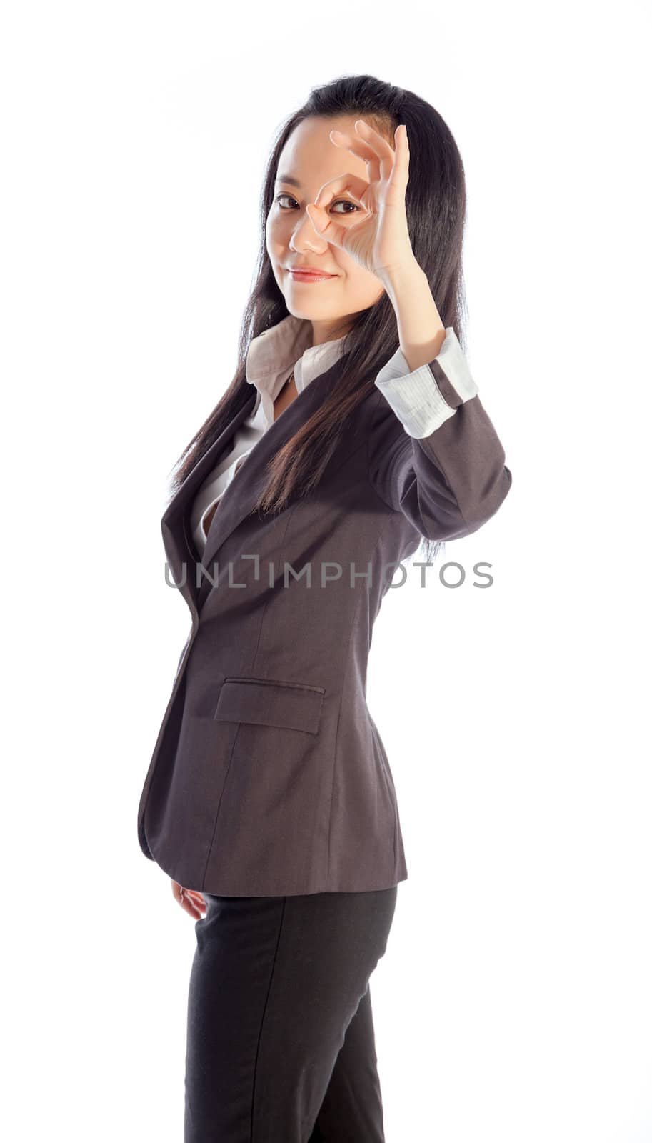 Attractive asian girl in her 30s shot in studio isolated on a white background