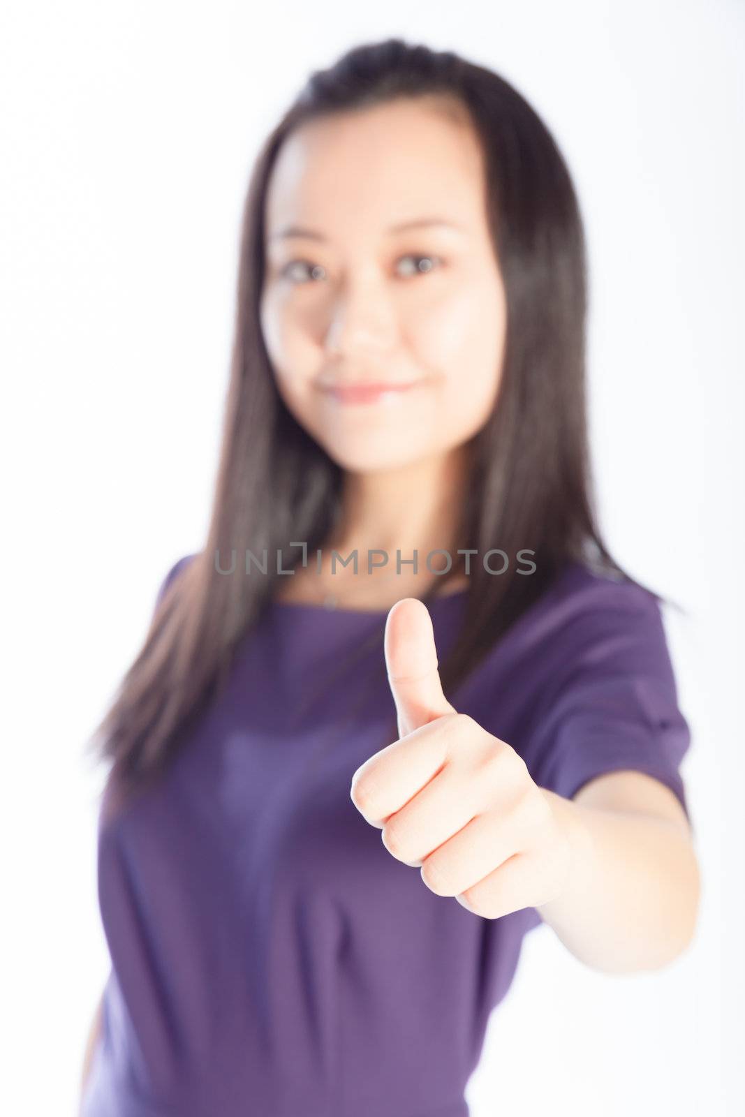 Attractive asian girl in her 30s shot in studio isolated on a white background