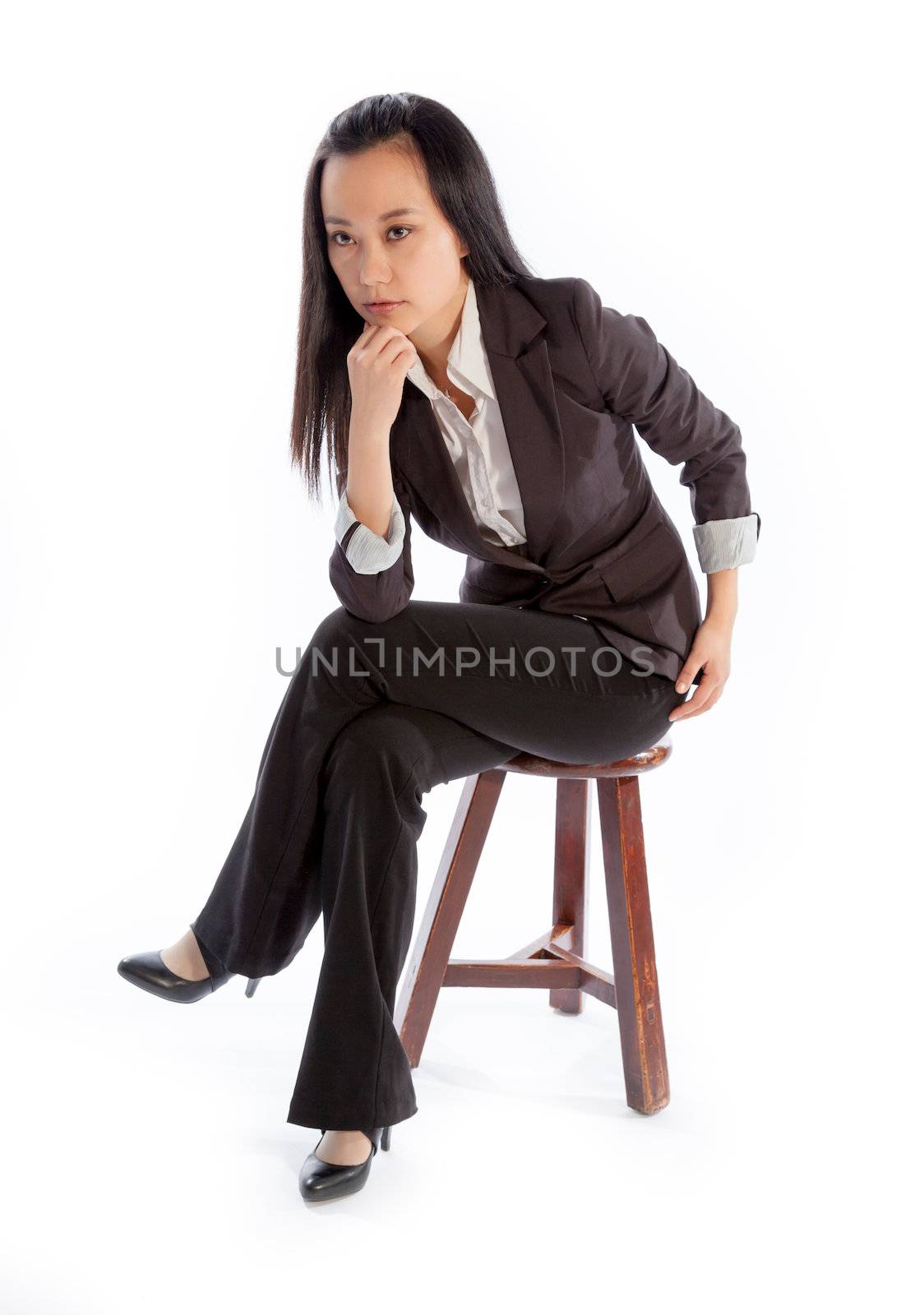 Attractive asian girl in her 30s shot in studio isolated on a white background