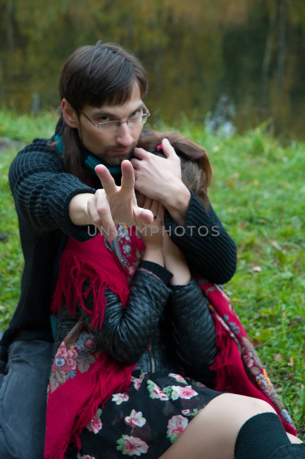 man woman closes the hand of the photographer