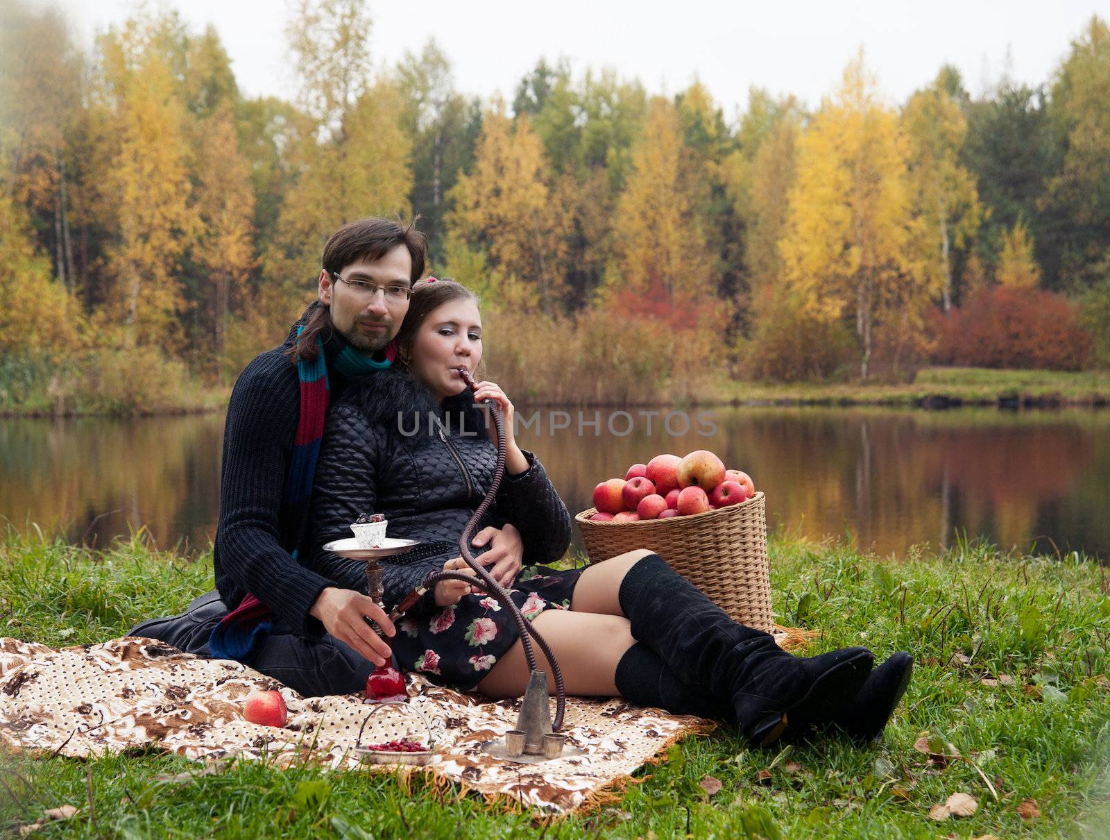 relationship between man and a woman at a picnic with a hookah