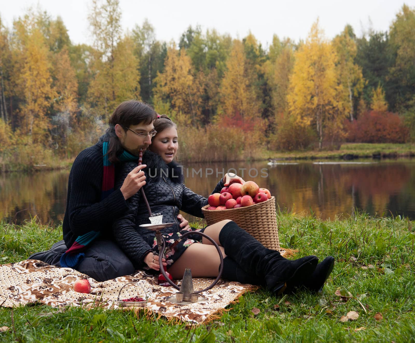 relationship between man and a woman at a picnic with a hookah