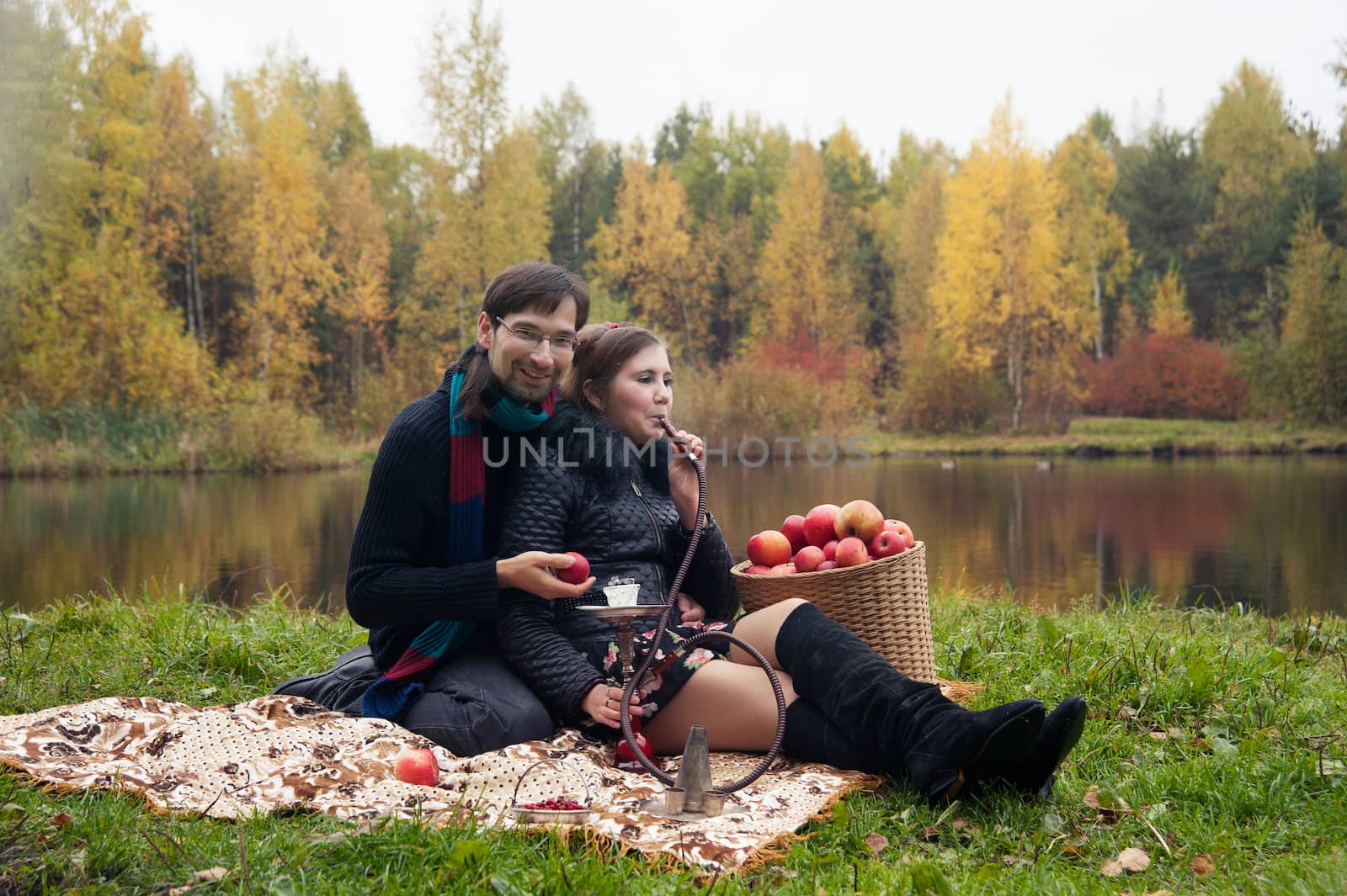 relationship between man and a woman at a picnic with a hookah