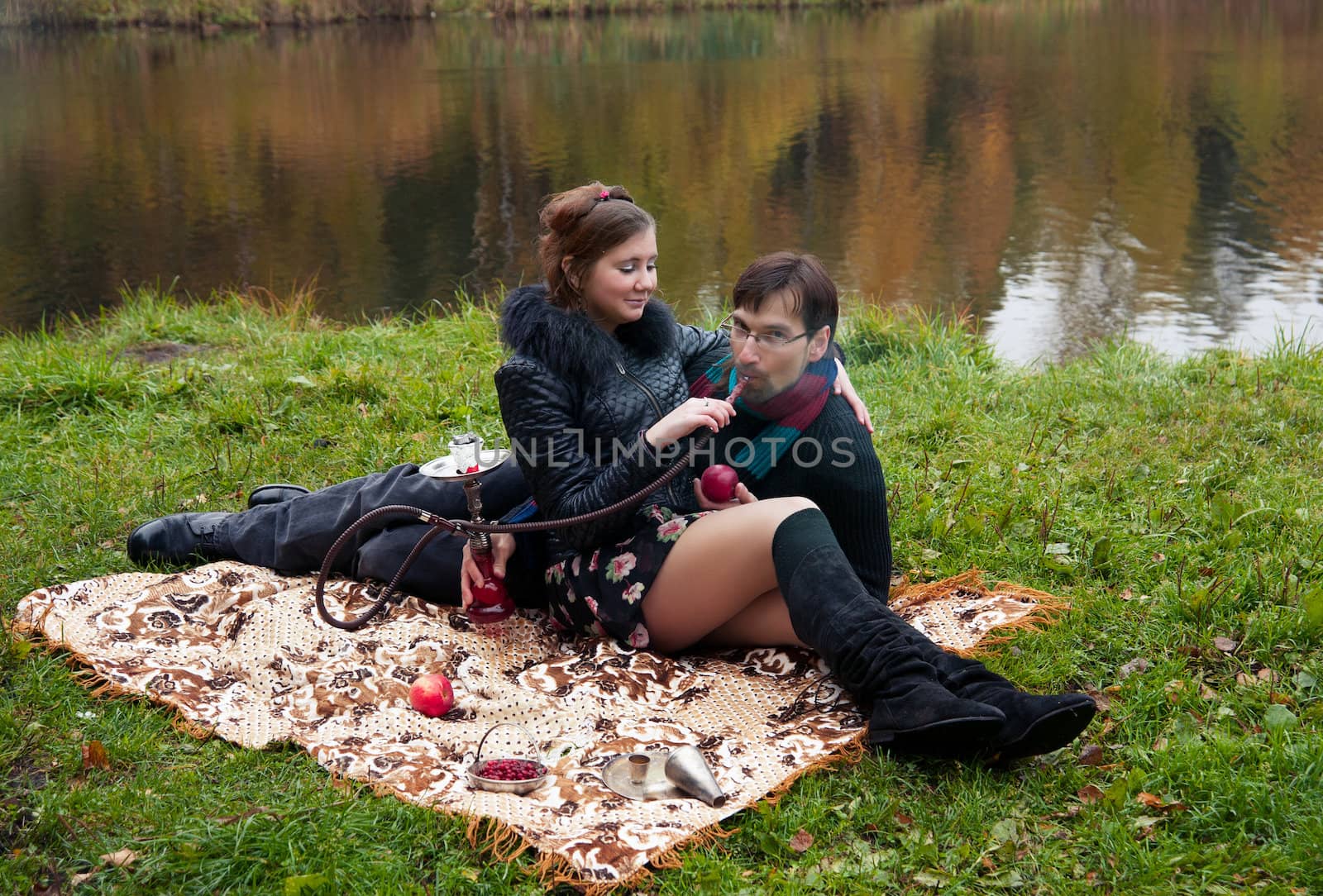 relationship between man and a woman at a picnic with a hookah