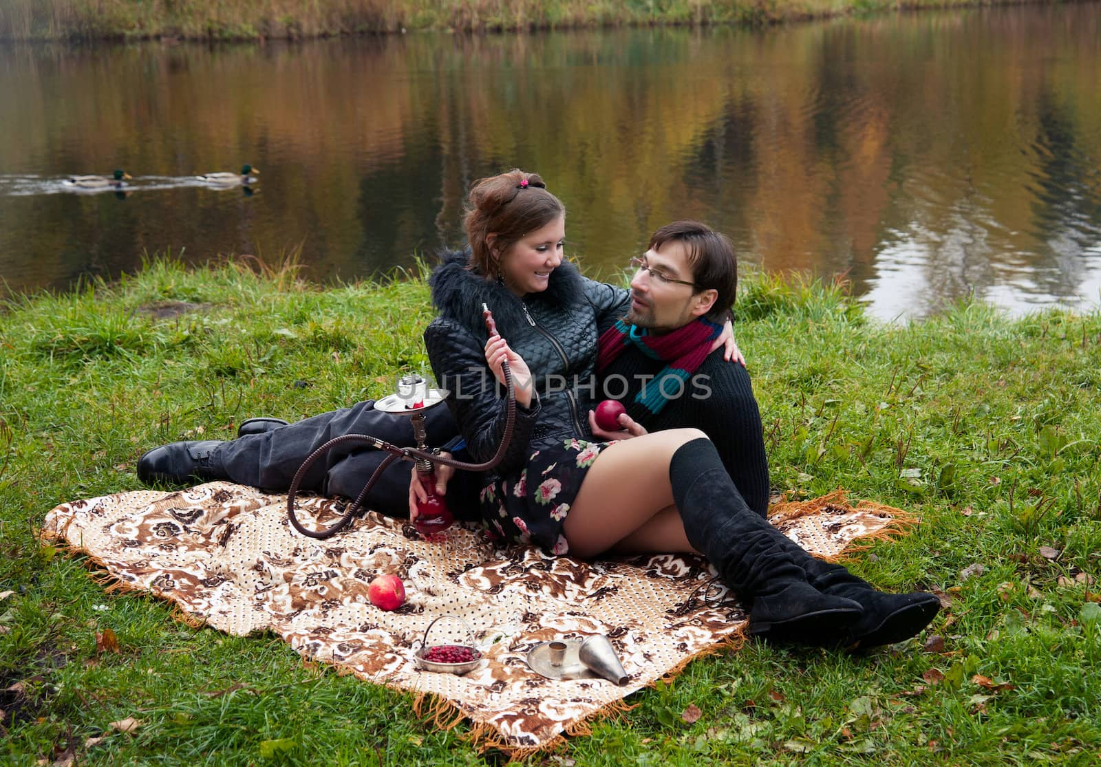 relationship between man and a woman at a picnic with a hookah